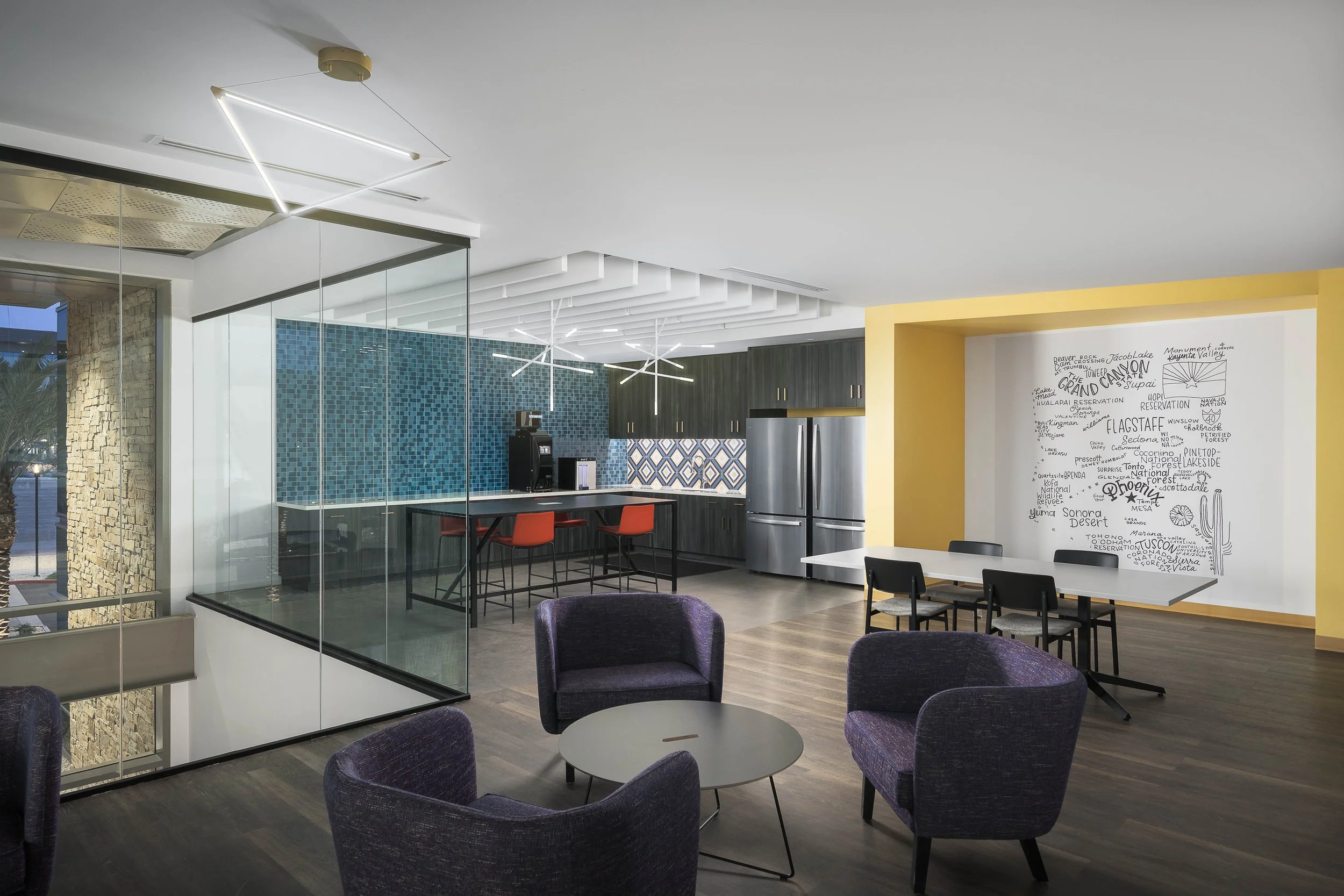 Glass-enclosed office breakout space with pendant grid ceiling and open collaborative floor plan — Choice Hotels Technology HQ, Cavasson Scottsdale AZ