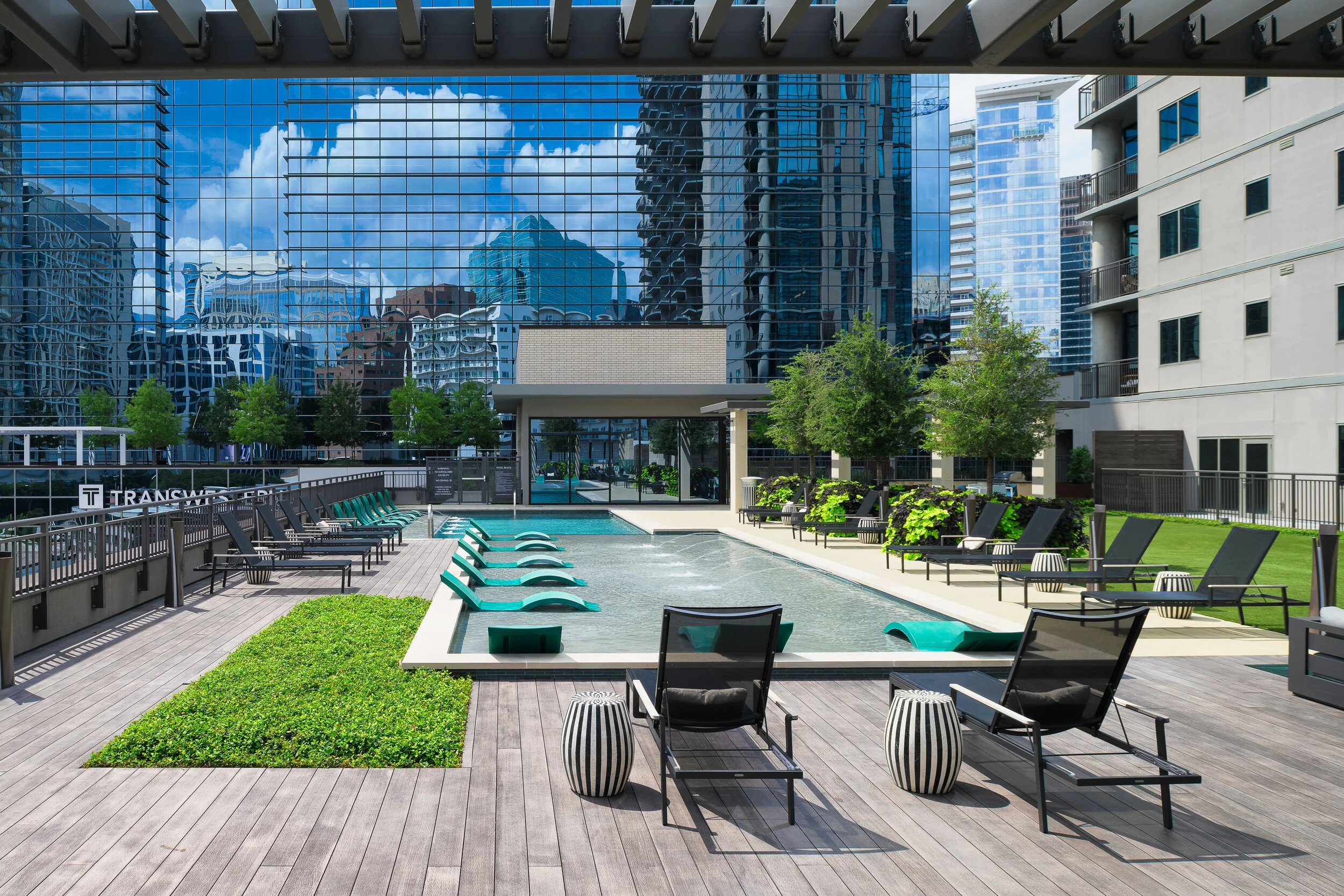 Modern commercial building exterior with glass facade and landscaping — commercial architecture photography