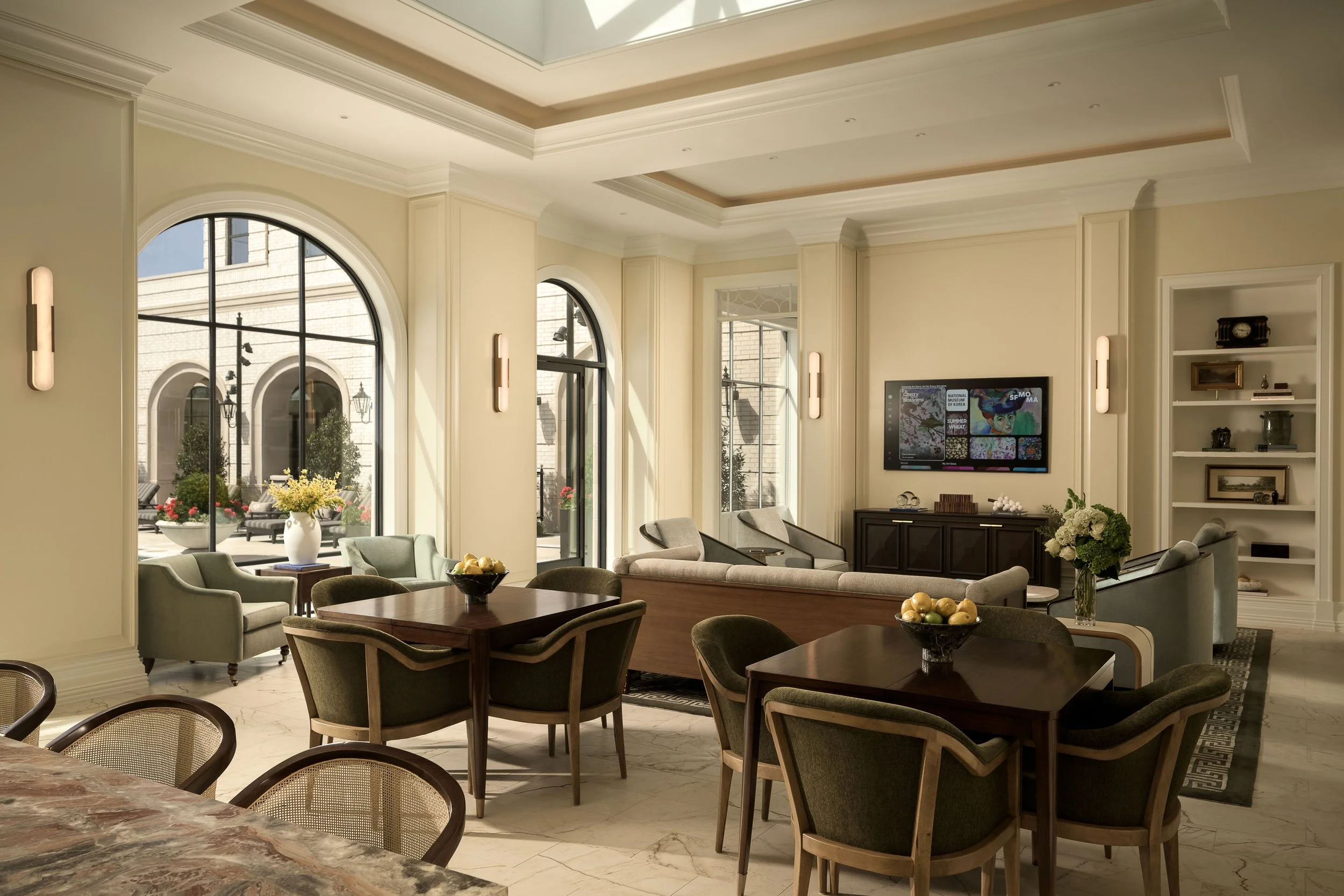 Upscale residential lounge with arched window, fireplace, and bespoke seating arrangement — high-end interior design, The Galatyn Dallas TX