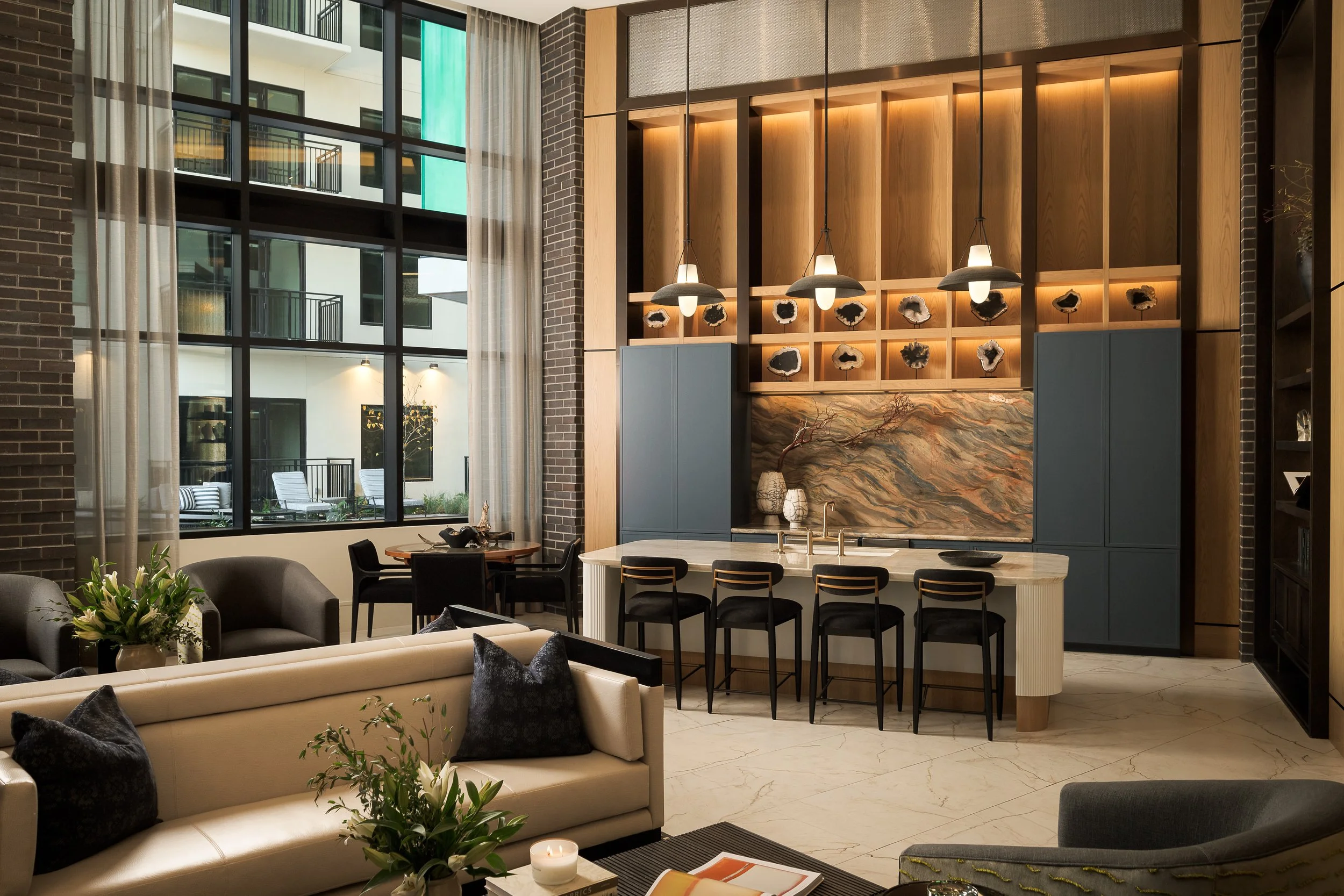 Modern office interior wModern hotel lobby with neutral tones and sculptural furniture arrangement — hospitality interior photographyHotel room workspace with contemporary desk and modern amenities — hospitality interior photographyith floor-to-ceili