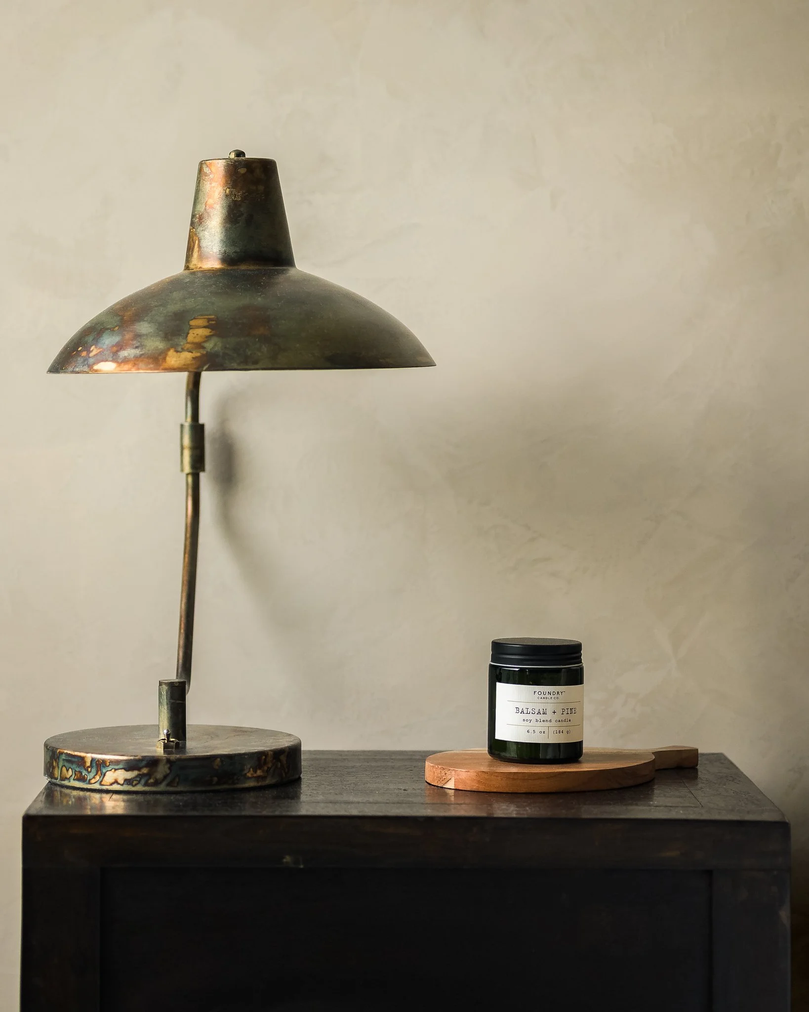 Minimalist residential interior with pendant lamp and organic textures — luxury interior photography