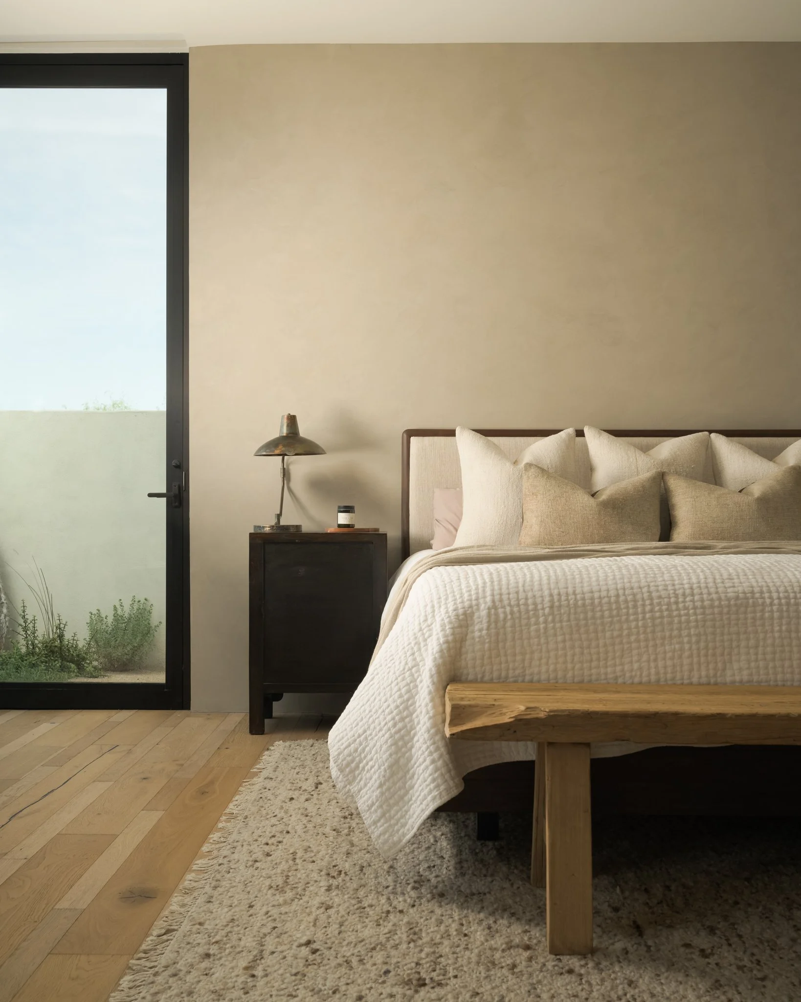 Serene white bedroom with linen bedding and natural light — residential interior photography