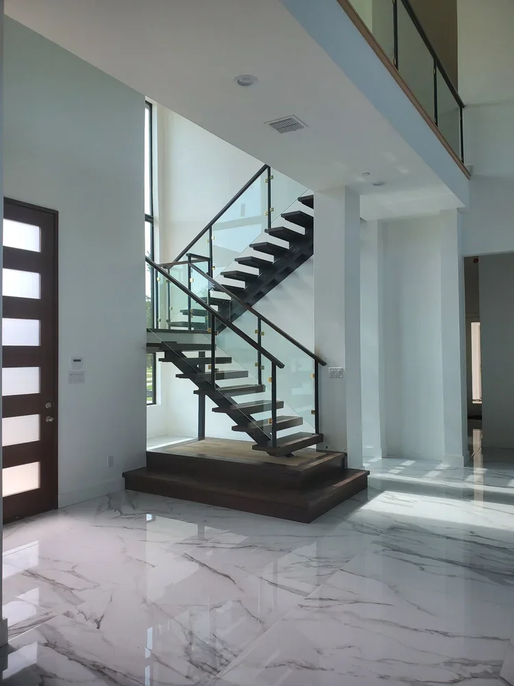 Southlake

-

Showcase your vision with grand entries featuring architectural floating staircases, glass railings, and flawless marble finishes that capture natural light masterfully.