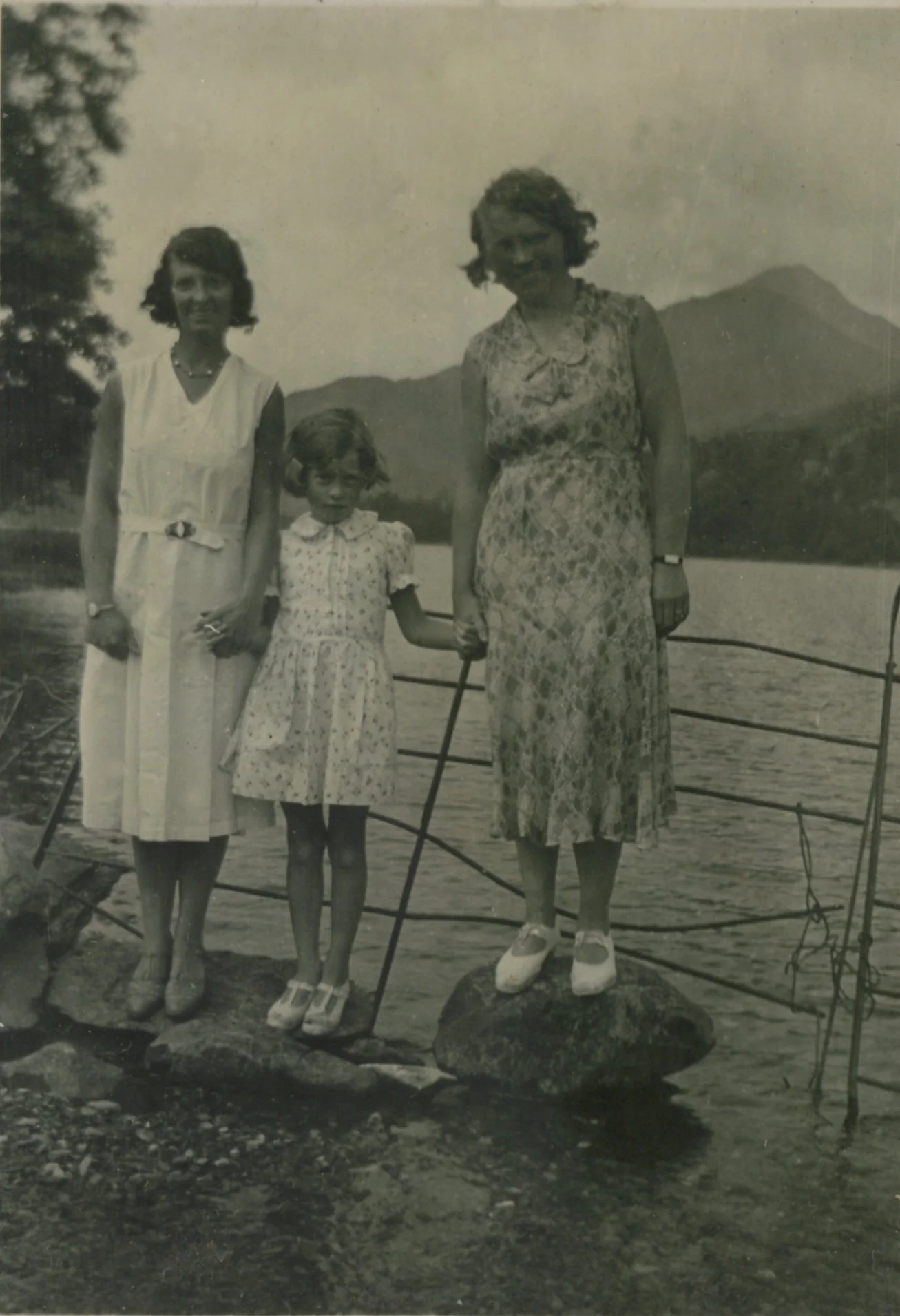 Local women and a girl on the Llyn Gwynant lakeshore, 1920s. 