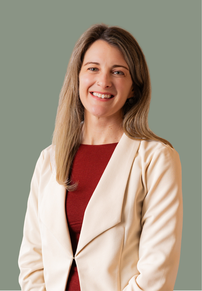 Smiling woman in a red shirt who is a Functional Medicine and Integrative Psychiatry PA in Alaska