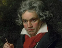 Portrait of Wolfgang Amadeus Mozart in classical attire with a red scarf, holding a pen.