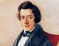 Portrait of a young man with dark, curly hair, wearing a dark suit and bow tie, against a neutral background.