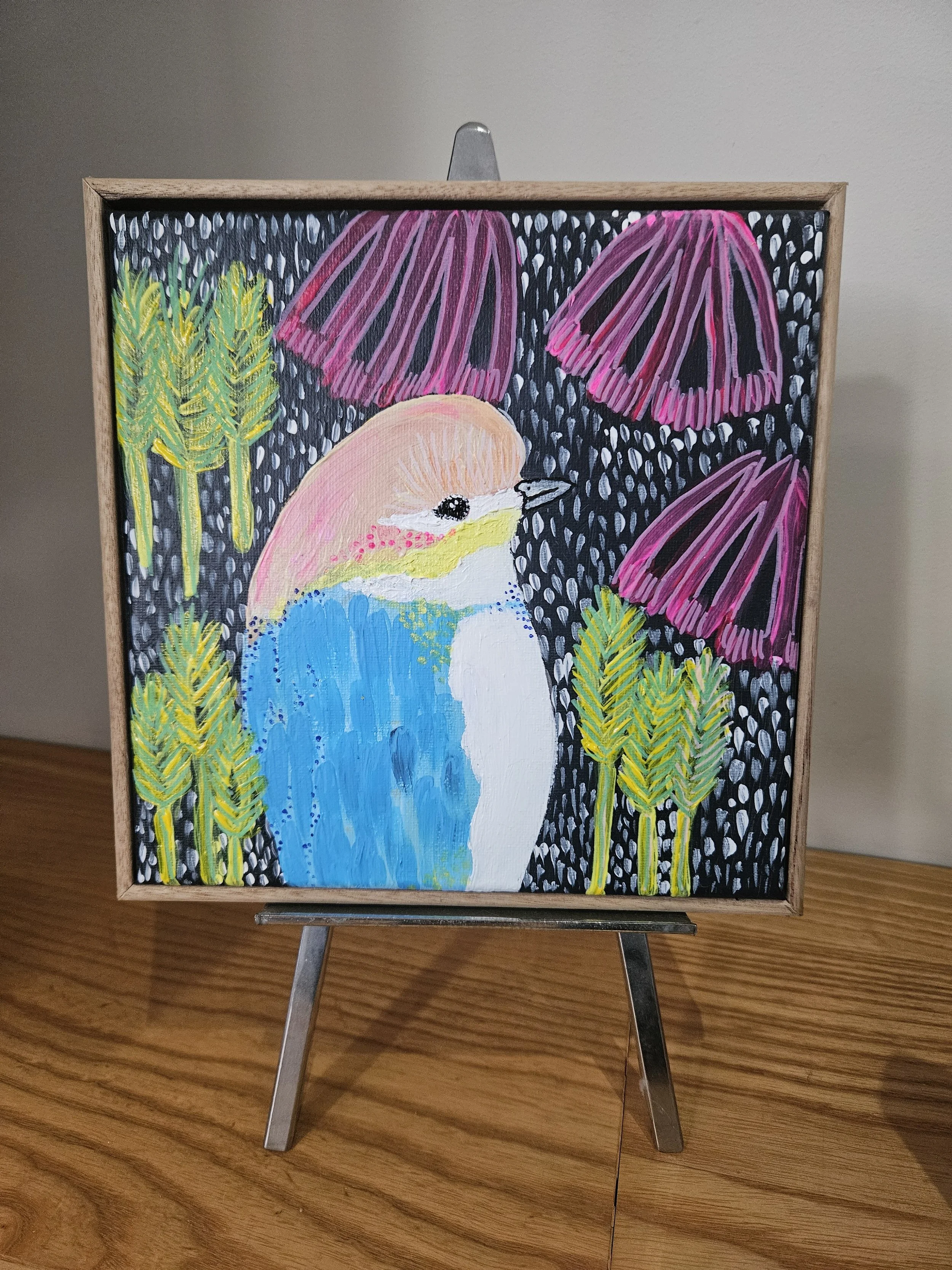 Painting of a bird surrounded by pink and purple mushrooms, and green plants, on a black dotted background.