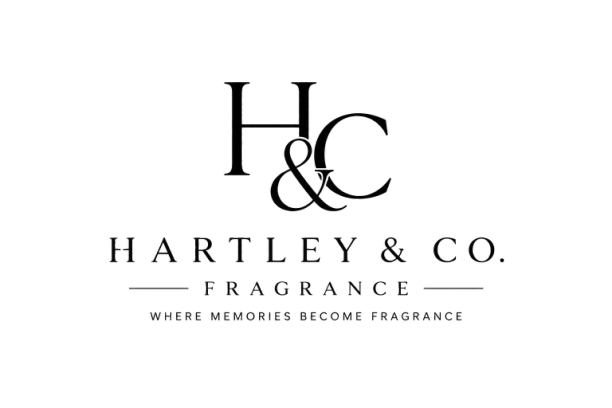 Close-up of a H&H Tile Co. logo on a textured surface.