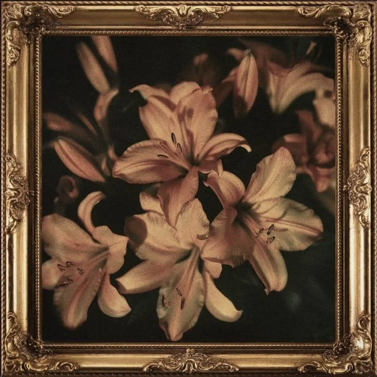 A framed painting of pink and white lilies against a dark background.