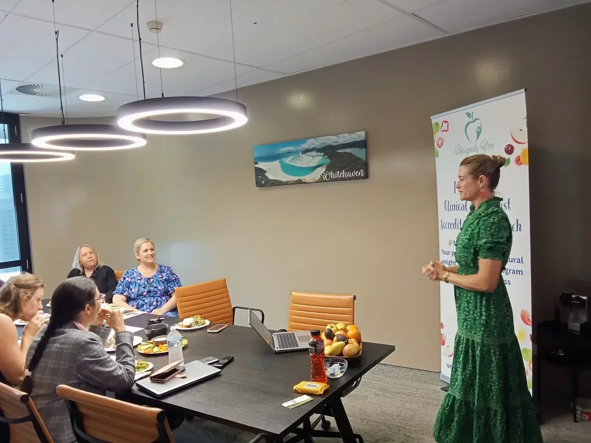 Melissa Cook delivering a workplace wellness workshop to a corporate team representing her corporate nutrition programs
