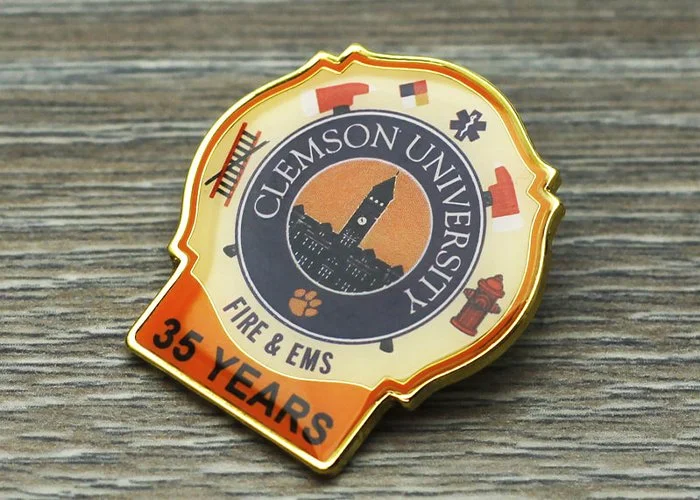 A Clemson University Fire & EMS badge celebrating 35 years, with symbols of fire rescue and emergency services.