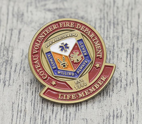 Lapel pin for the Beaux Volunteer Fire Department, life member since 1980, with fire rescue symbols and motto.