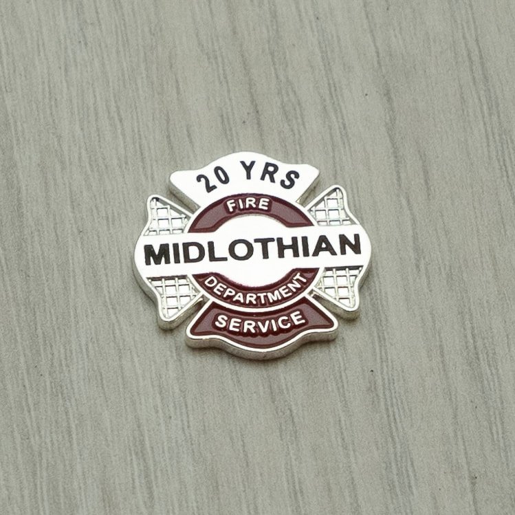 Firefighter maltese style pin commemorating 20 years of service in the Midlothian Fire Department.
