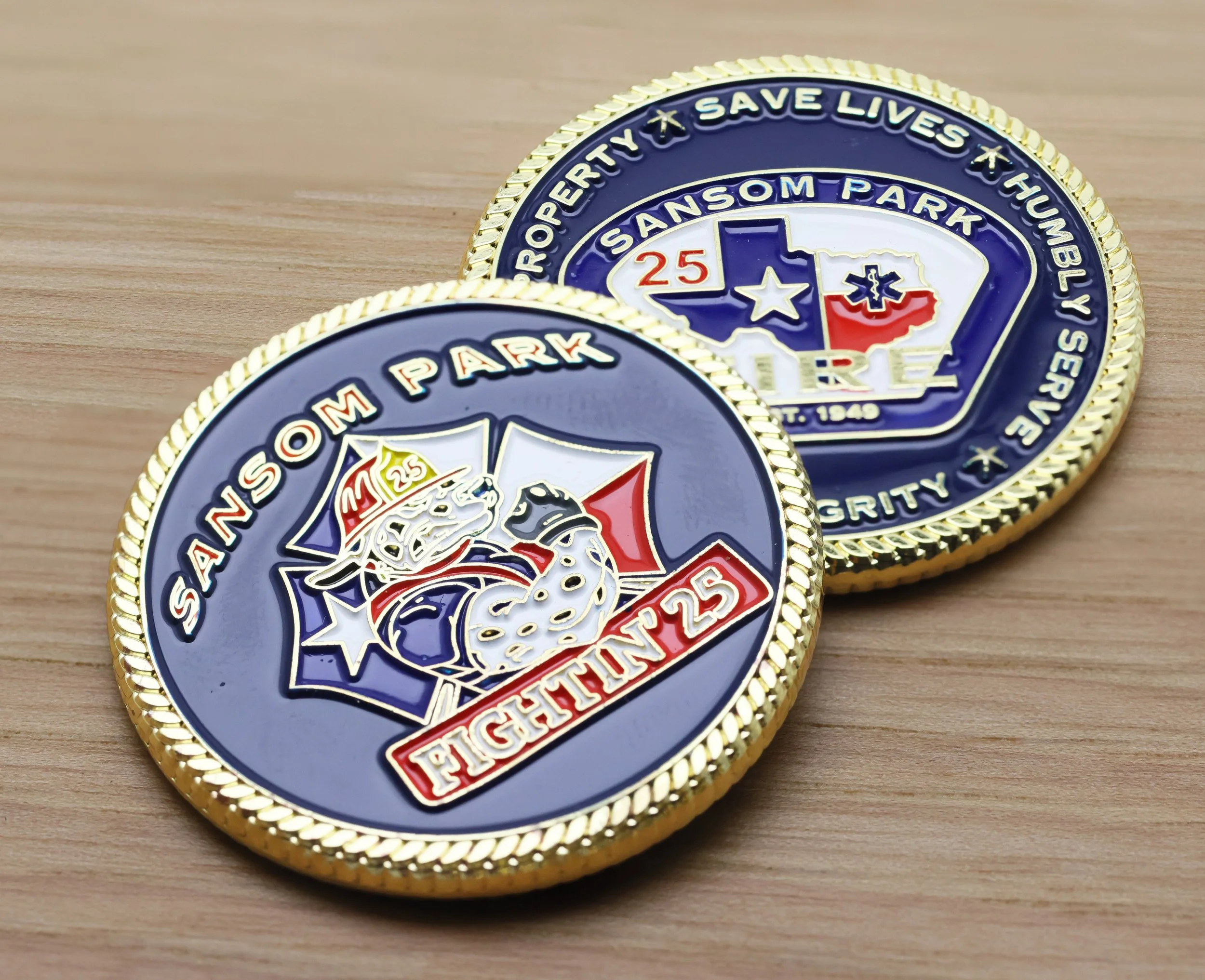 Close-up of challenge coins  for Samson FD, Texas.