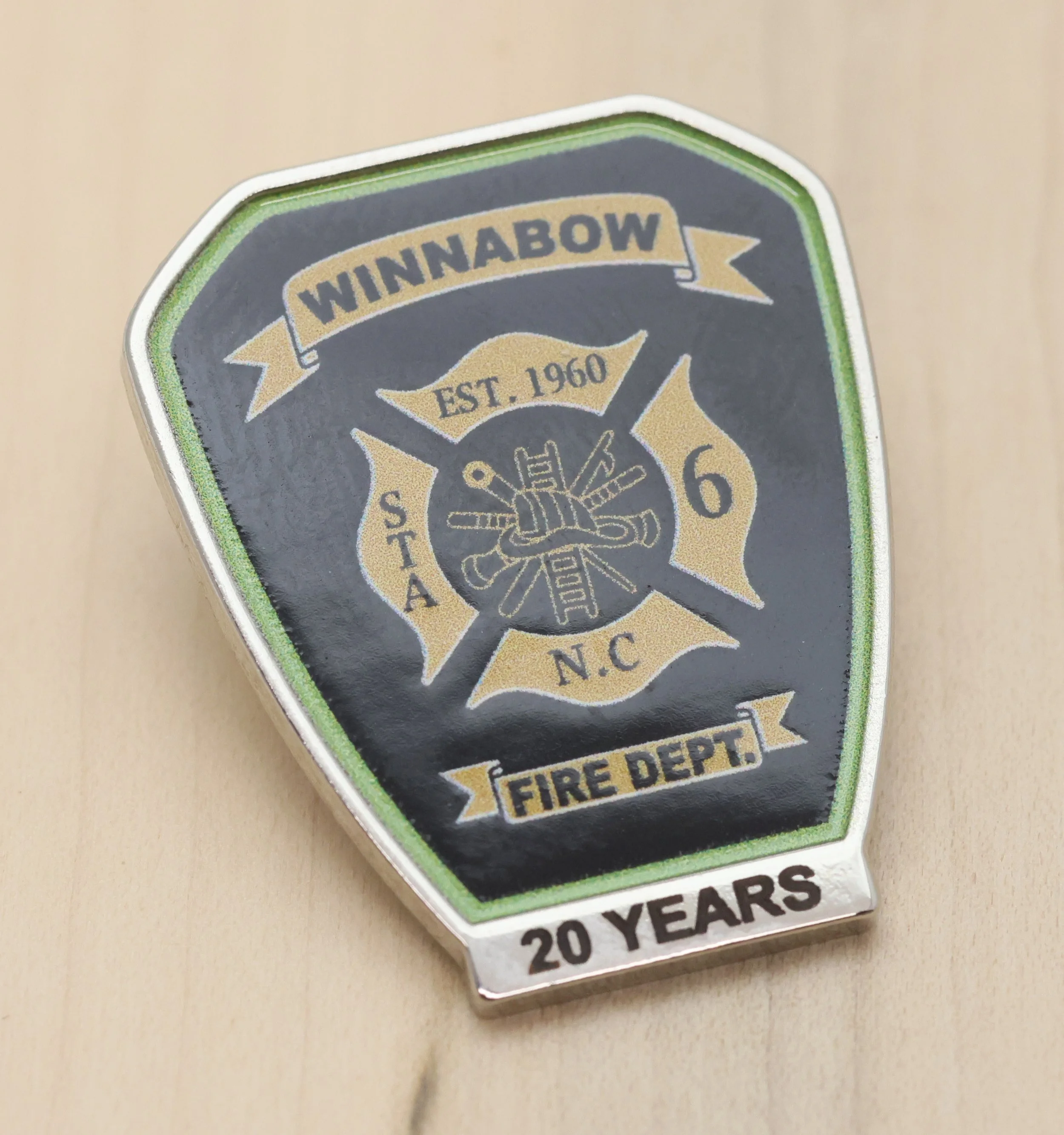 A years of service pin celebrating 20 years of the Winnabow Fire Department, established in 1960.
