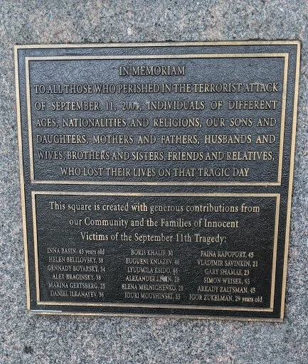 Memorial plaque commemorating victims of the September 11, 2001 terrorist attack, listing names of victims and noting contributions from the community.