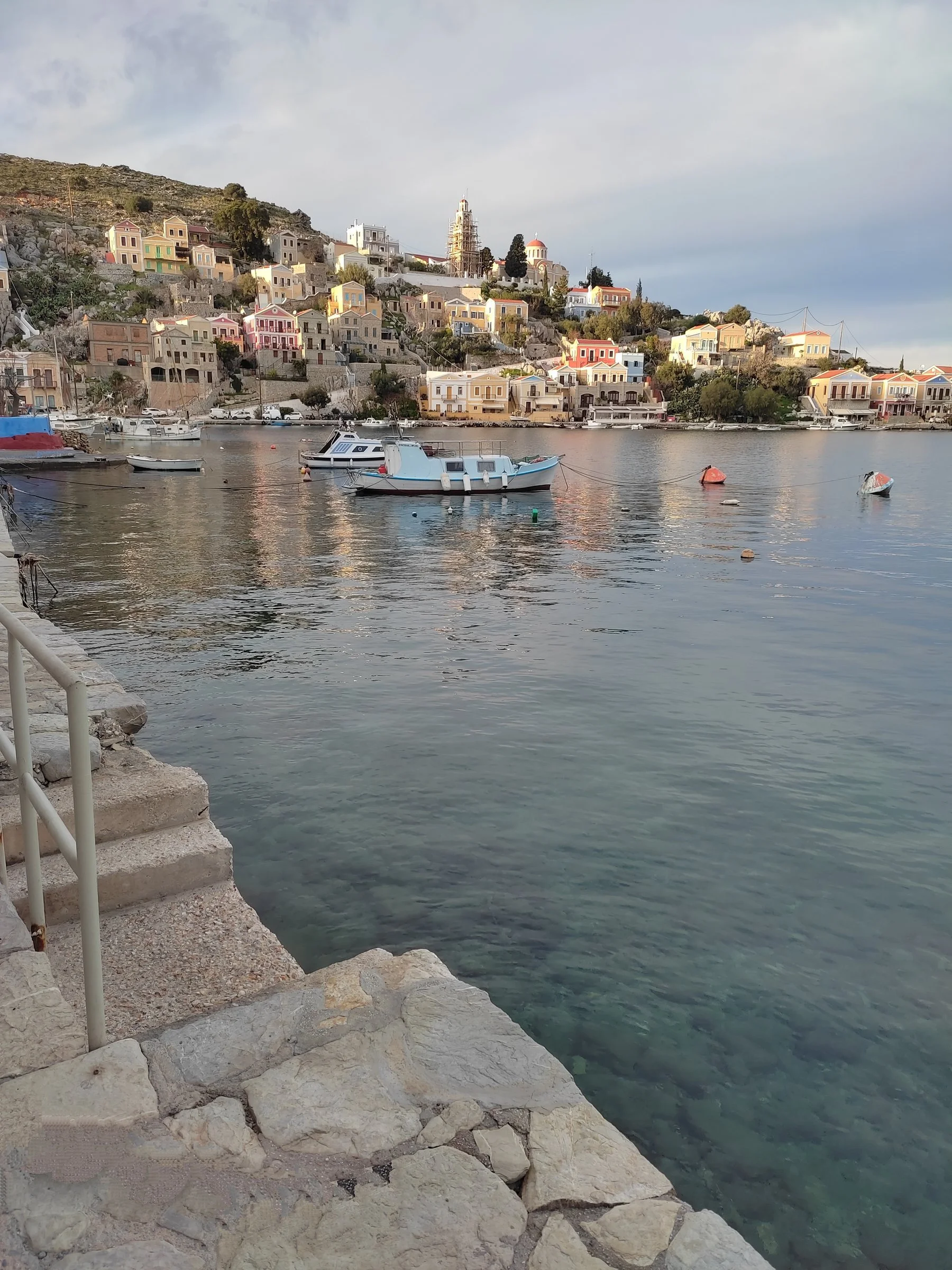 Steps of stone leading the eyes to a neoclassical dream across the harbor.