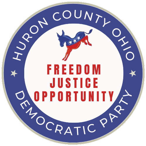 Circle emblem with a blue outer ring reading 'Huron County Ohio Democratic Party,' and a white inner circle featuring a blue donkey decorated with stars and red and white stripes, with the words 'Freedom Justice Opportunity' in red.