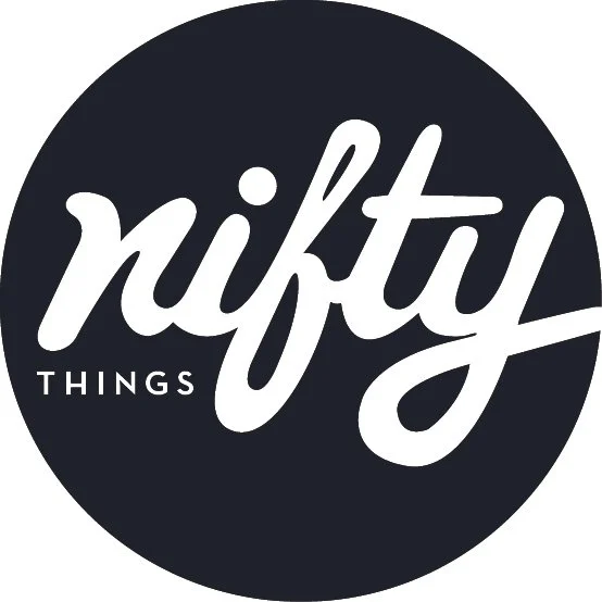 Nifty Things Logo - a Navy/Black circle with white text writing out "nifty things"