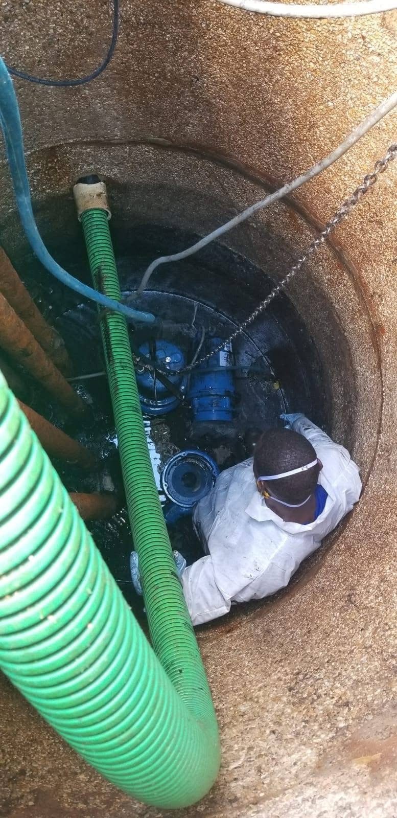 Rodclif Anderson, owner of A&E Contractors & Waste Management, performing a septic tank repair and inspection for a residential customer in Northwest Louisiana.