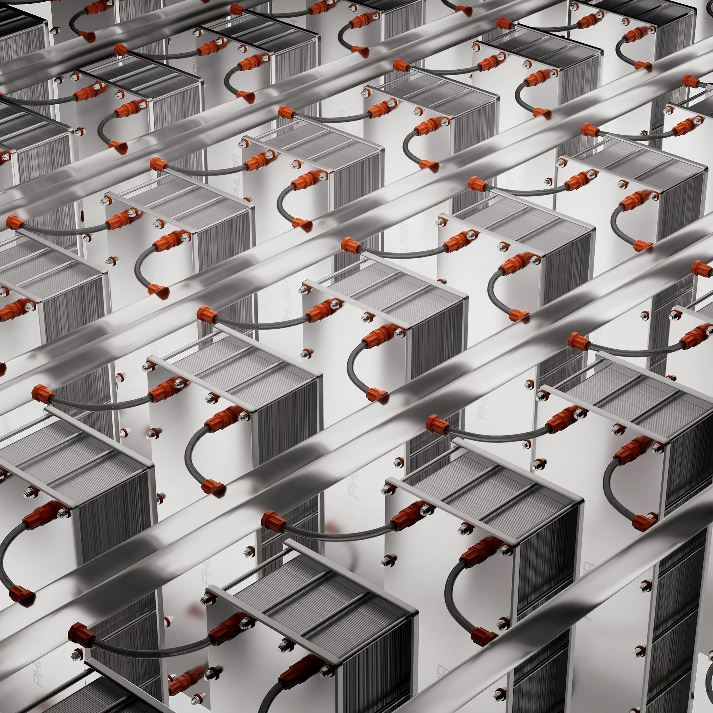 A large indoor area with several rows of silver server or computer equipment units connected by black and orange cables.