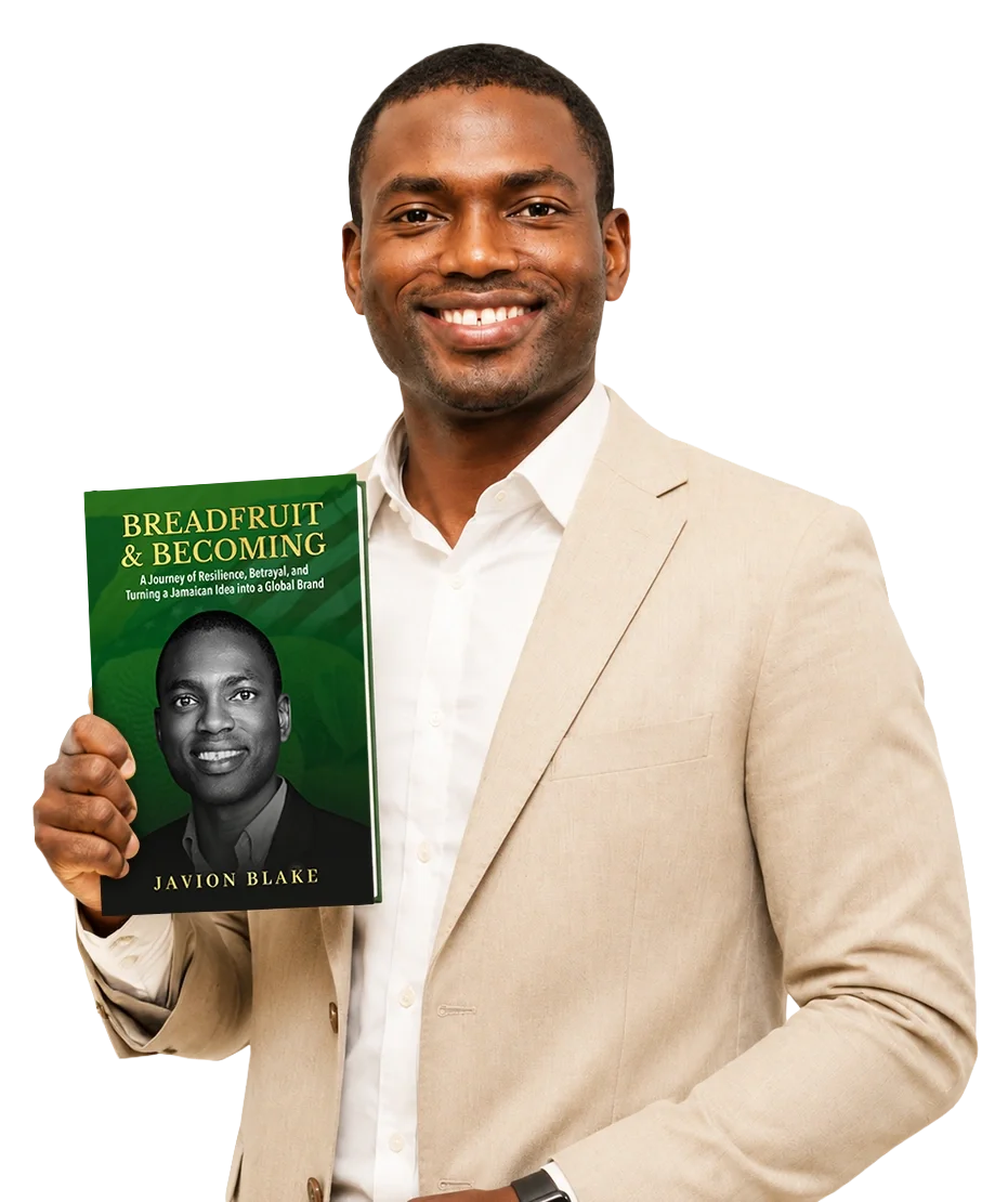 Javion Blake holding Breadfruit & Becoming beside the book cover