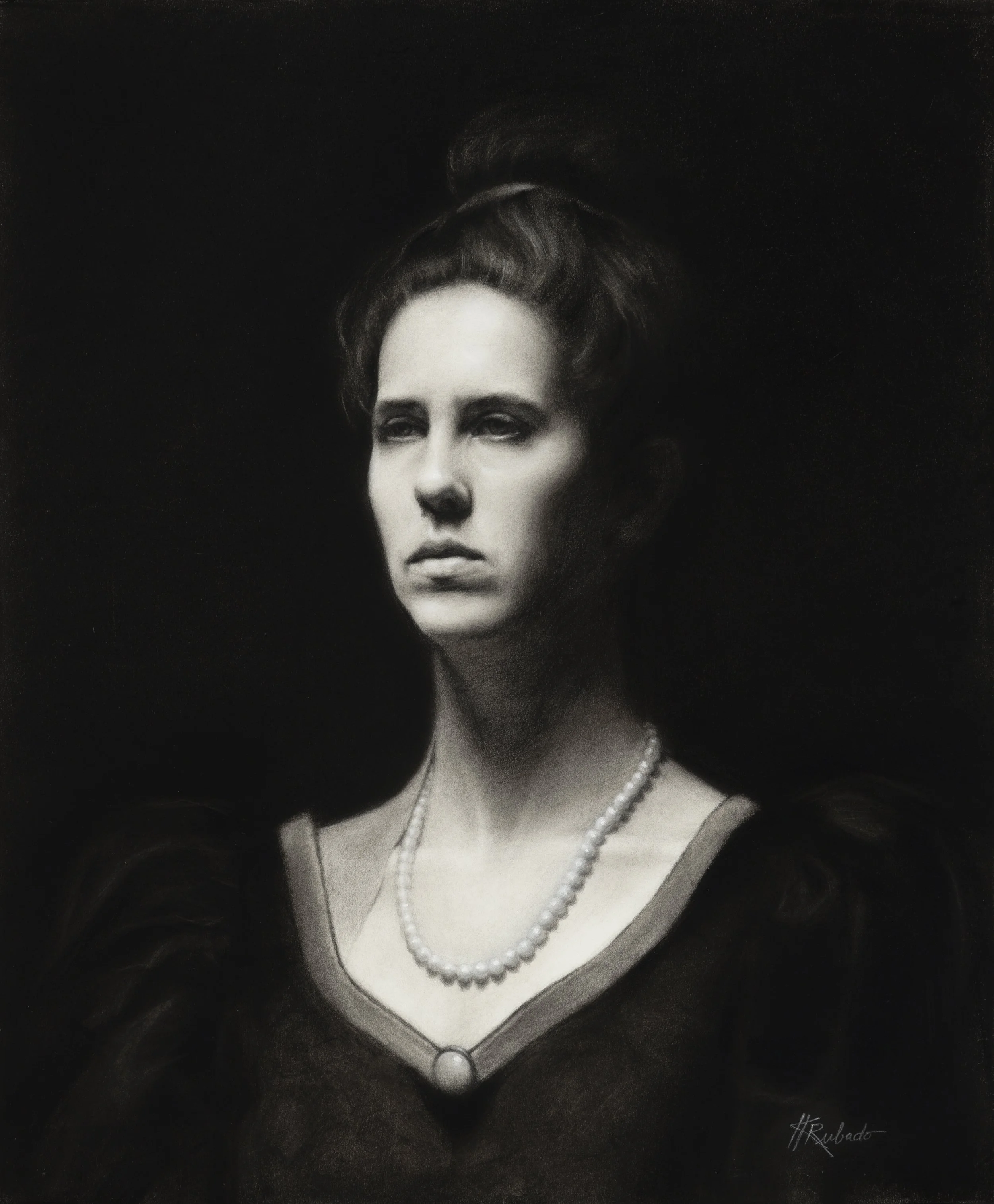Black-and-white portrait of a woman with dark hair, dramatic eye makeup, and a pearl necklace against a dark background