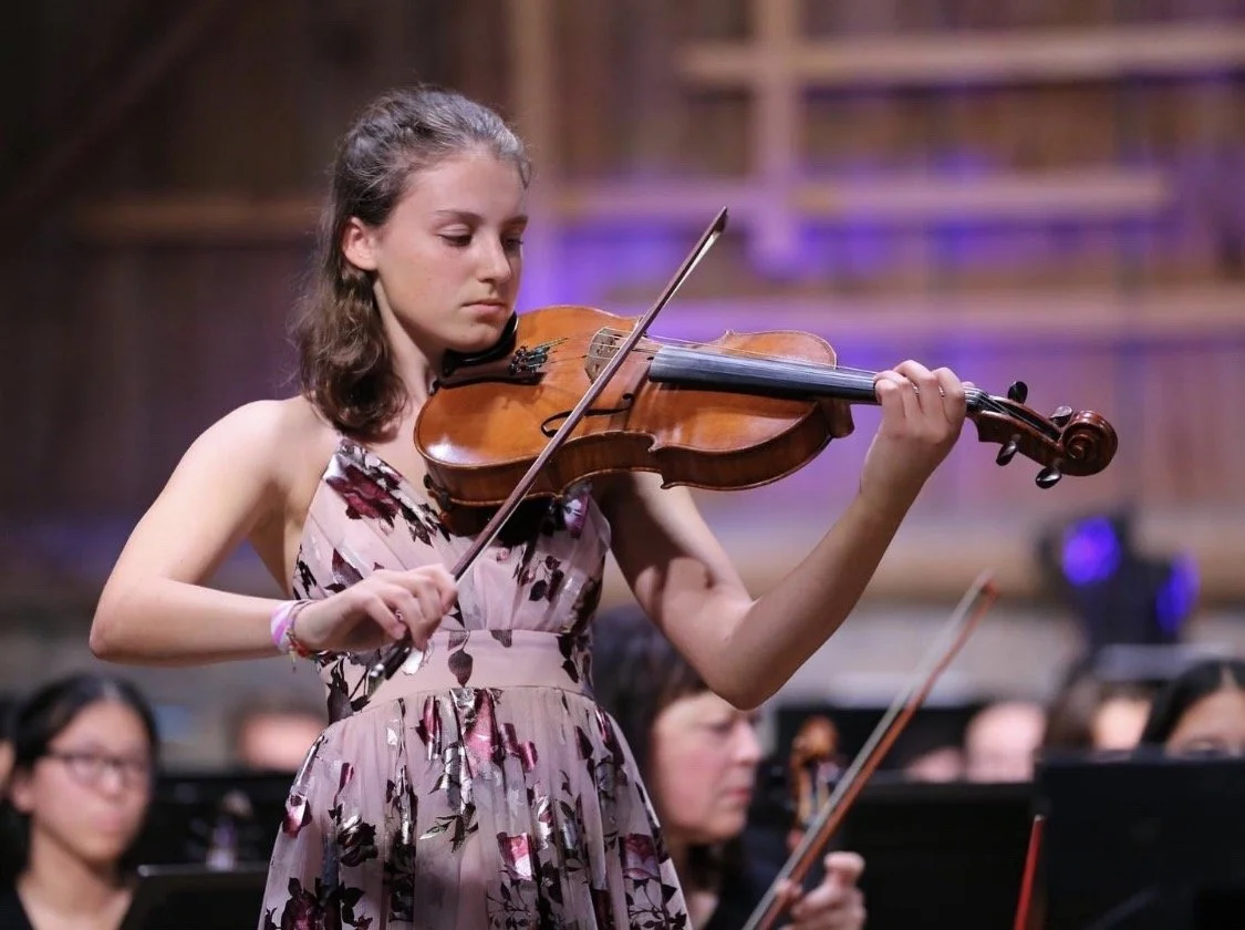 Young woman playing the viola at a Birch Creek Symphony concert