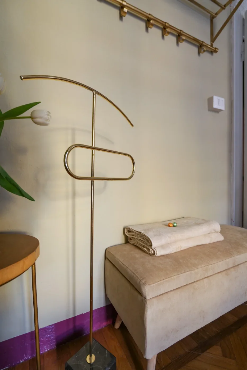 Brass valet stand by a velvet bench, Midsummer Night room — House of Frames, design B&B Milan