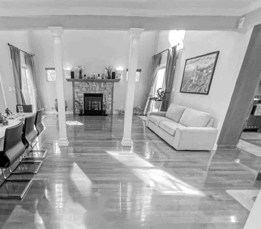 Villa US Residence before the intervention — original living room with columns and stone fireplace