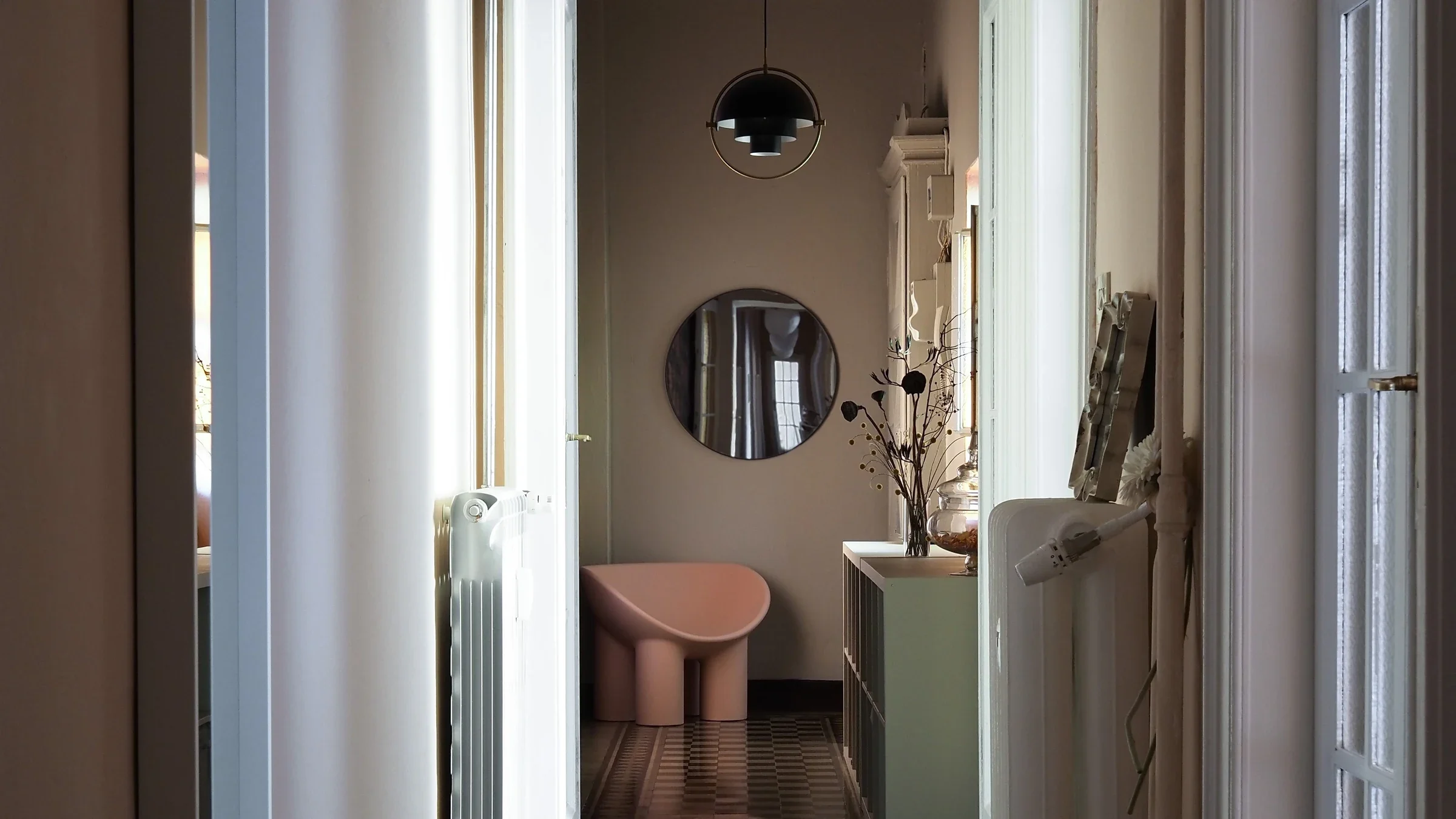 Pink Roly-Poly chair, round mirror and Gubi Multi-Lite pendant, entrance nook — House of Frames, Milan