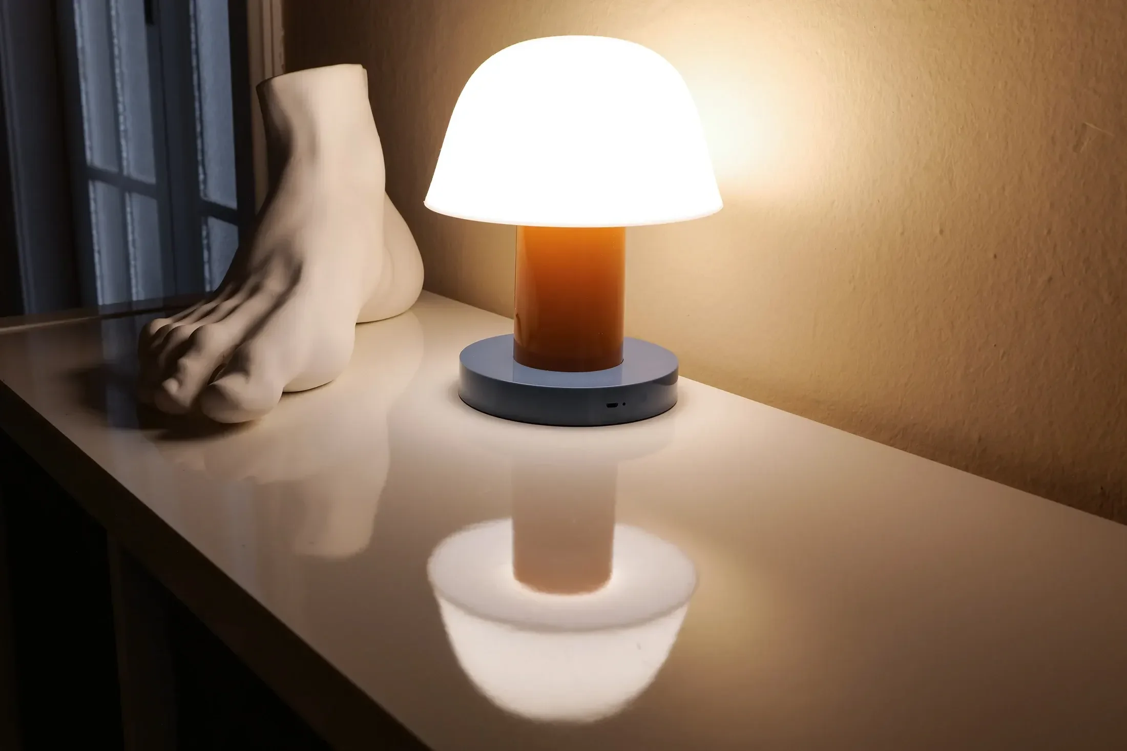 Seletti cast-foot sculpture and andTradition Setago lamp by Jaime Hayon on the lacquered console