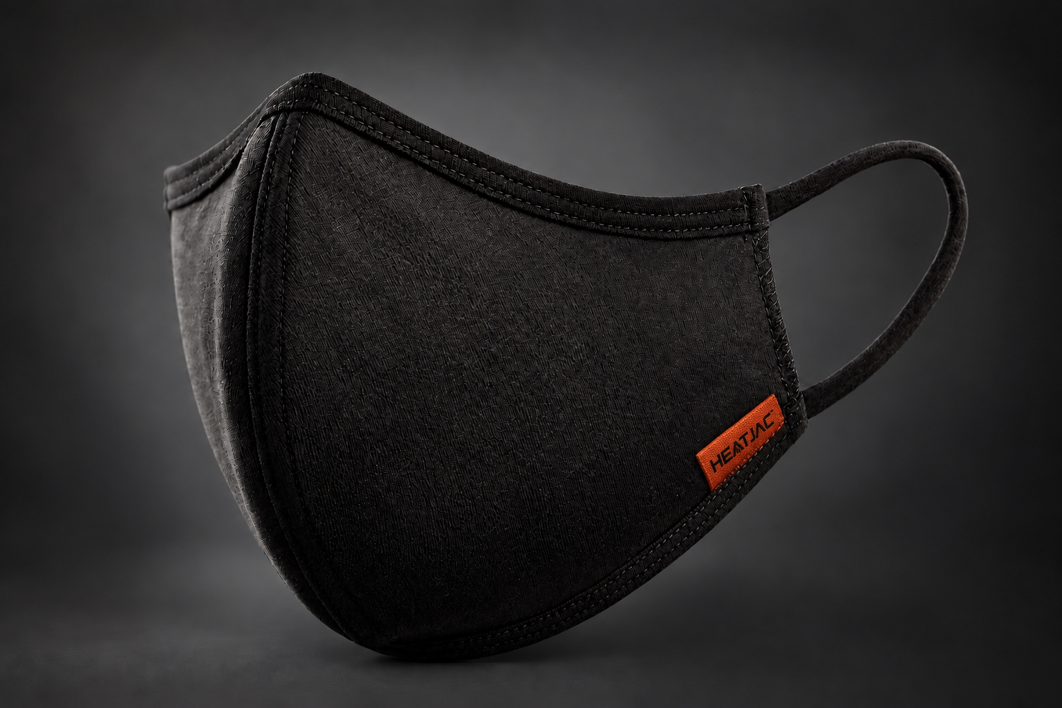 Black HEATJAC Mask with Orange Seam Tab.png