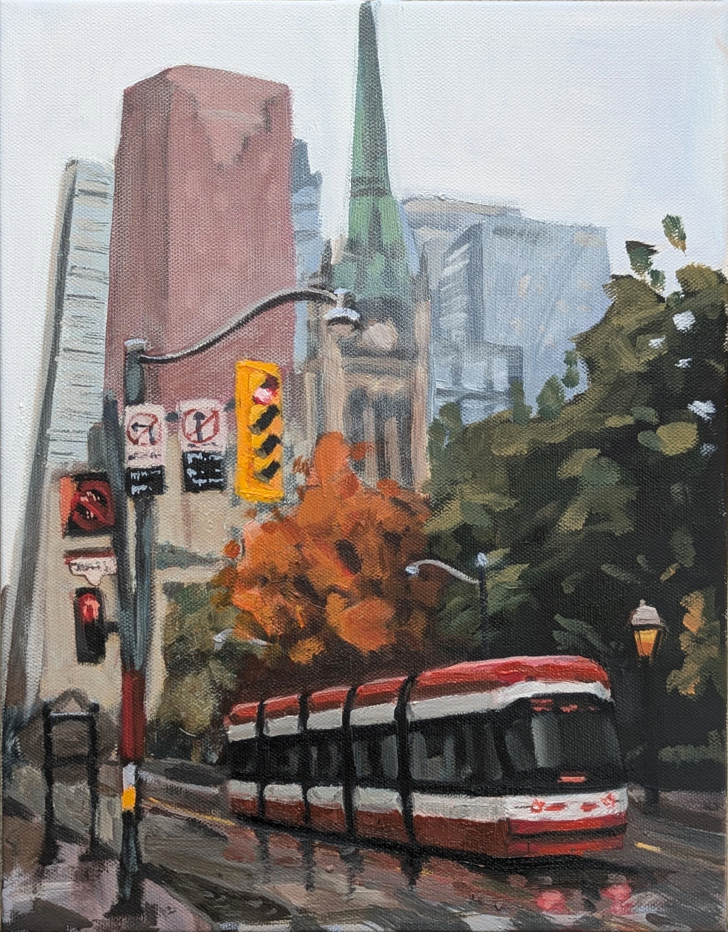 A painted city street scene of a Toronto Streetcar on a wet road, traffic lights, and trees with orange and green leaves, with tall buildings in the background.
