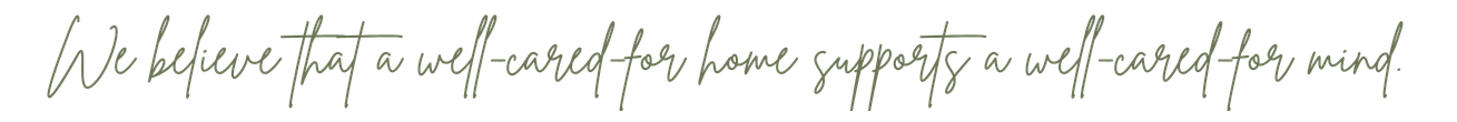 Handwritten note on black paper that says, 'We believe that a well-cared for home supports a well-cared for mind'.