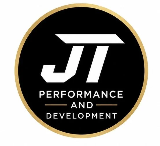 A circular logo with a black background and a gold border, featuring the white text "JT" and "Performance and Development" underneath.