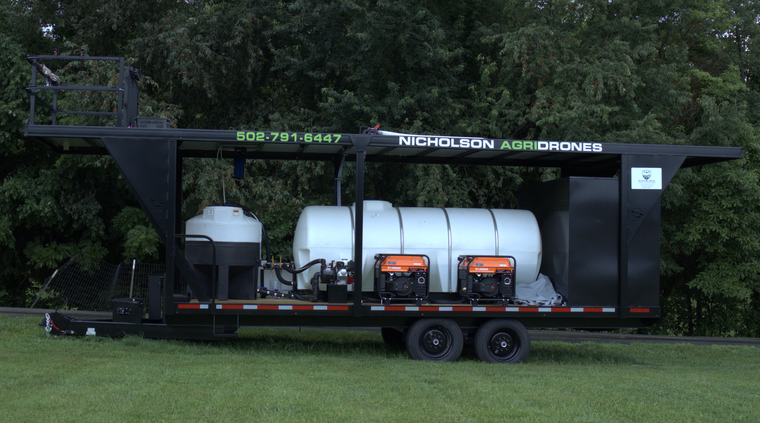 Nicholson AgriDrones spray trailer with 1000gallon tank, 175 gallon mix tank, flight deck and generators.