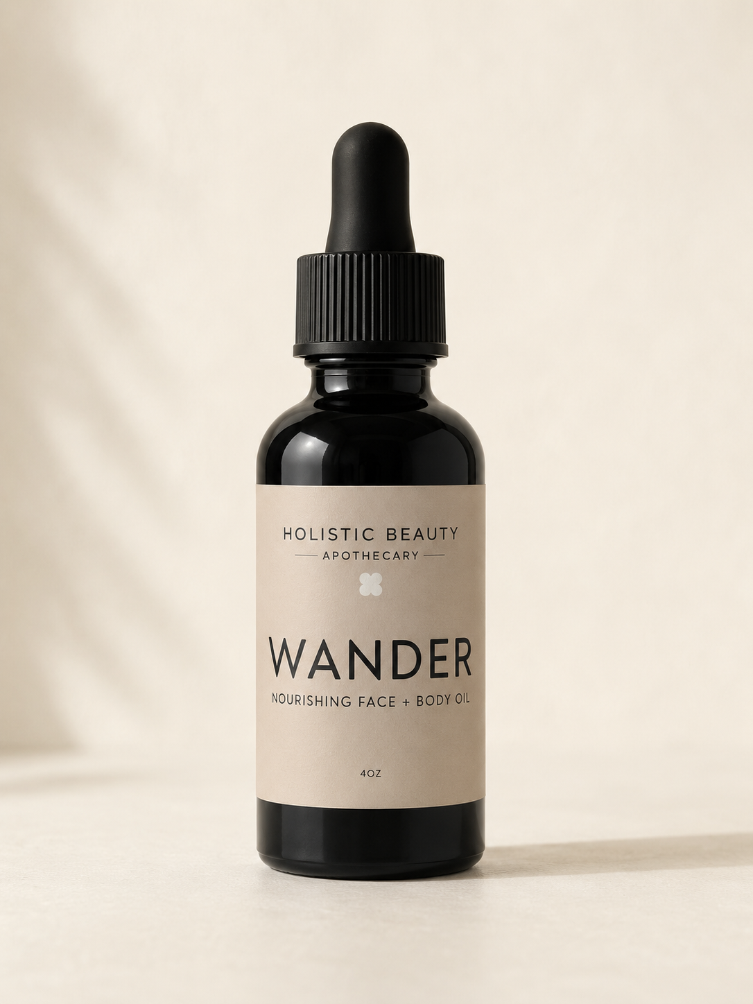 A black bottle with a dropper cap labeled 'Holistic Beauty Apothecary Wander Nourishing Face + Body Oil, 4oz'.