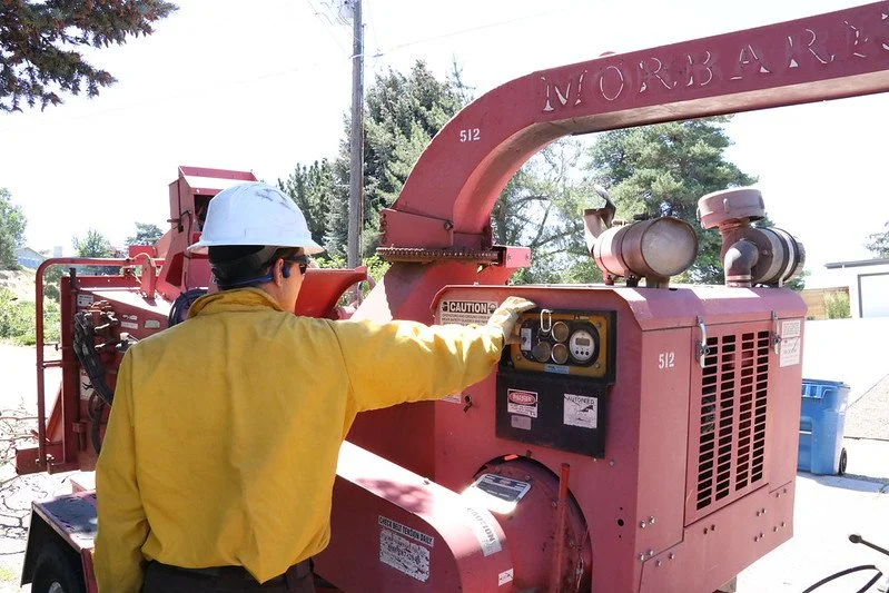 Wildfire mitigation crew clearing brush and dead fuel near Glade Park