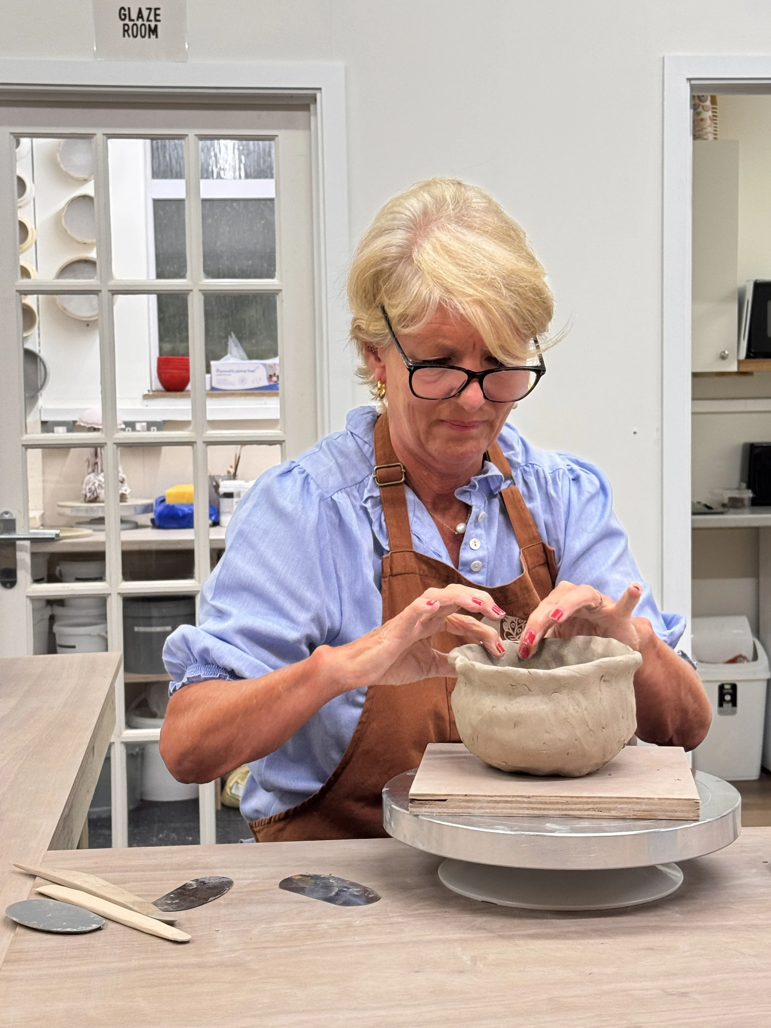 A student at Henfield Pottery, in West Sussex hand-building with clay at a Hand-building course.