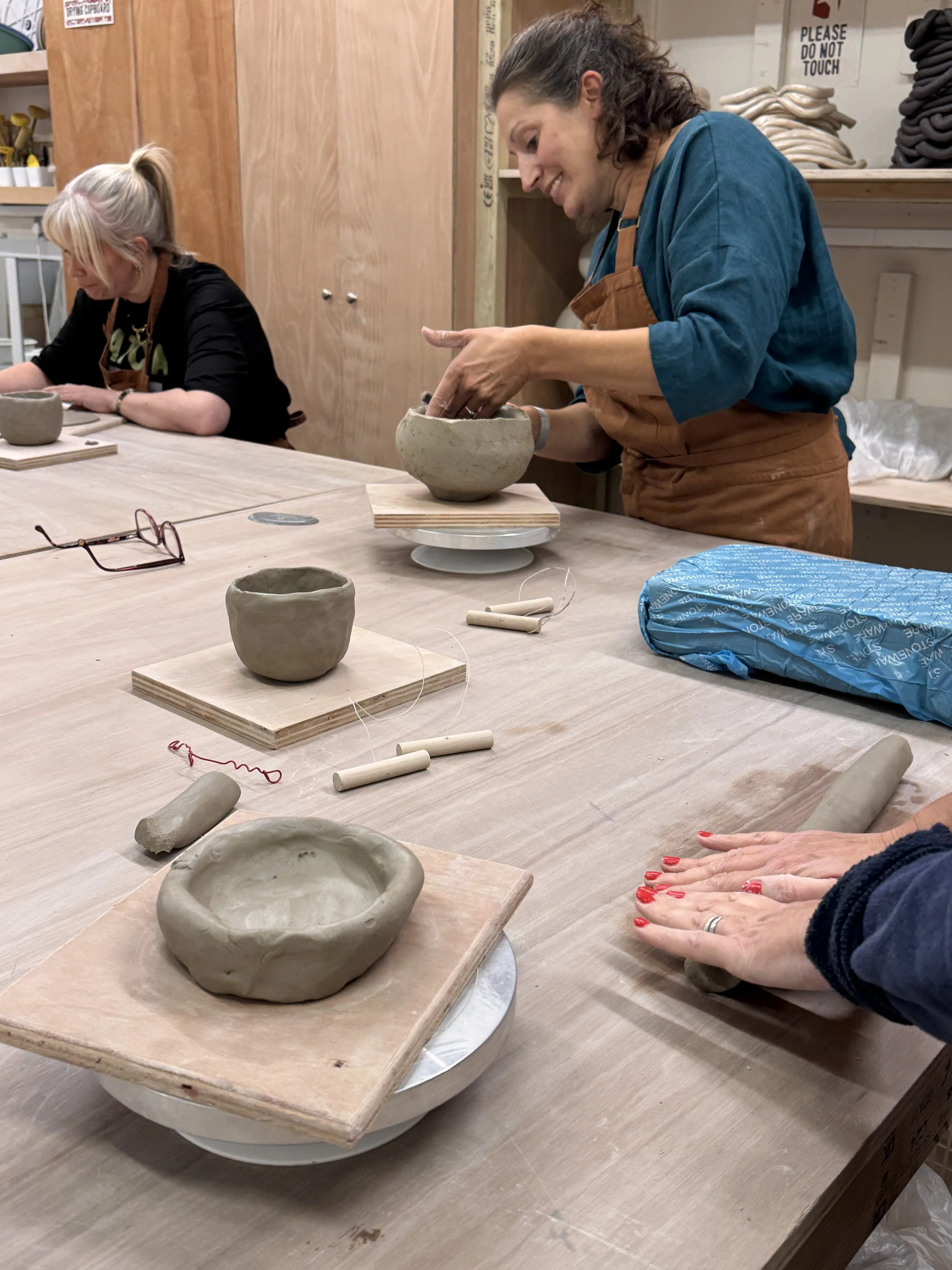 A student hand-building with clay at Henfield Pottery Studio