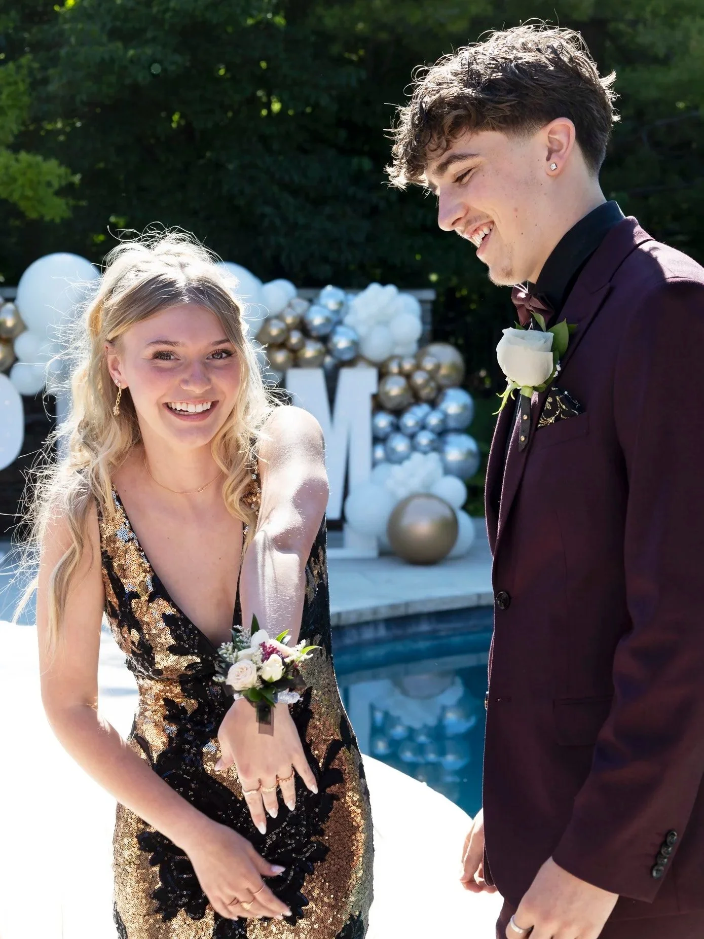 Prom photo capturing the moment after her boyfriend put on her corsage