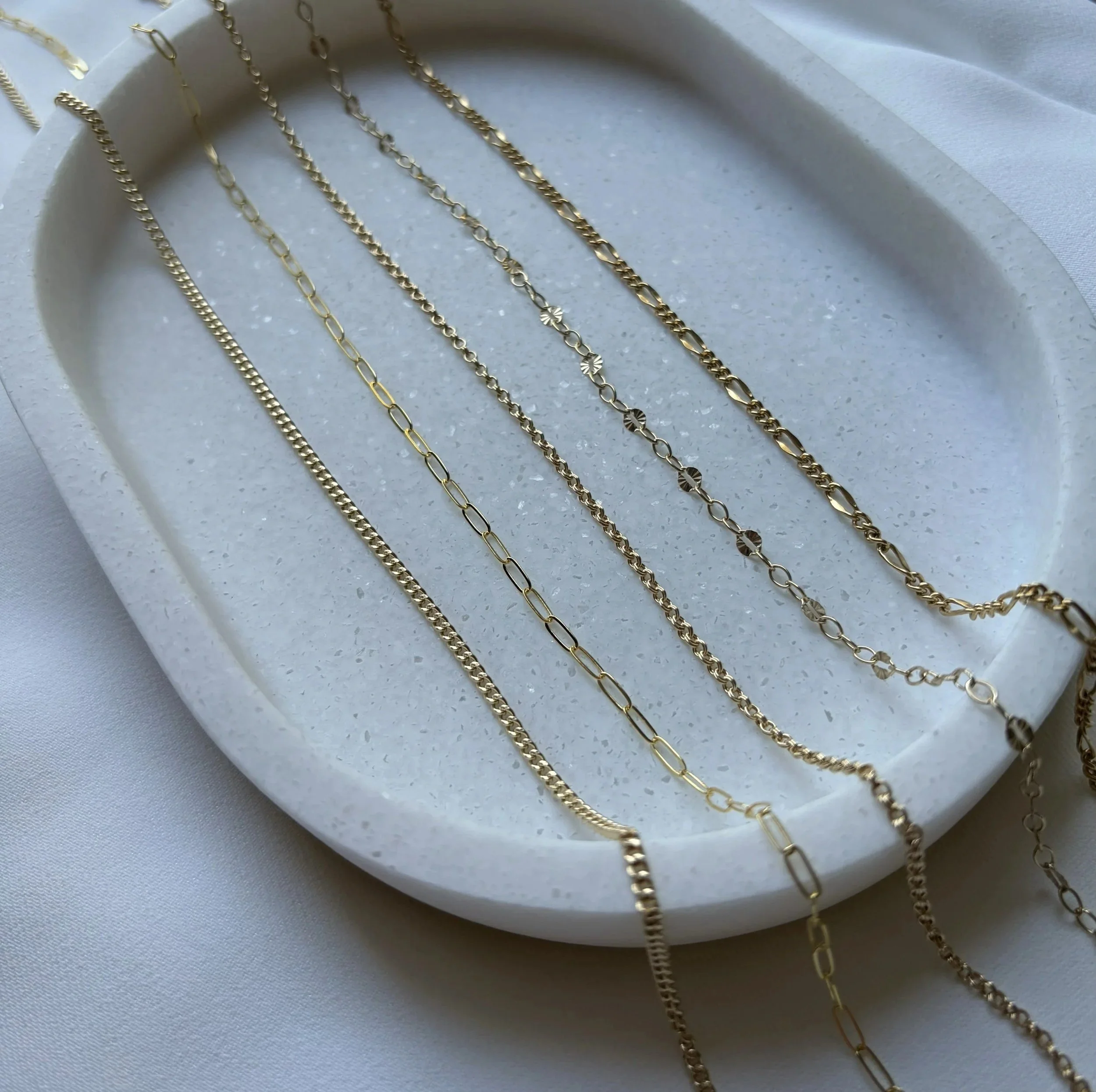 gold chains in a variety of styles.  Dainty, delicate, bracelet, necklace and anklet chains.  Custom fit- chains