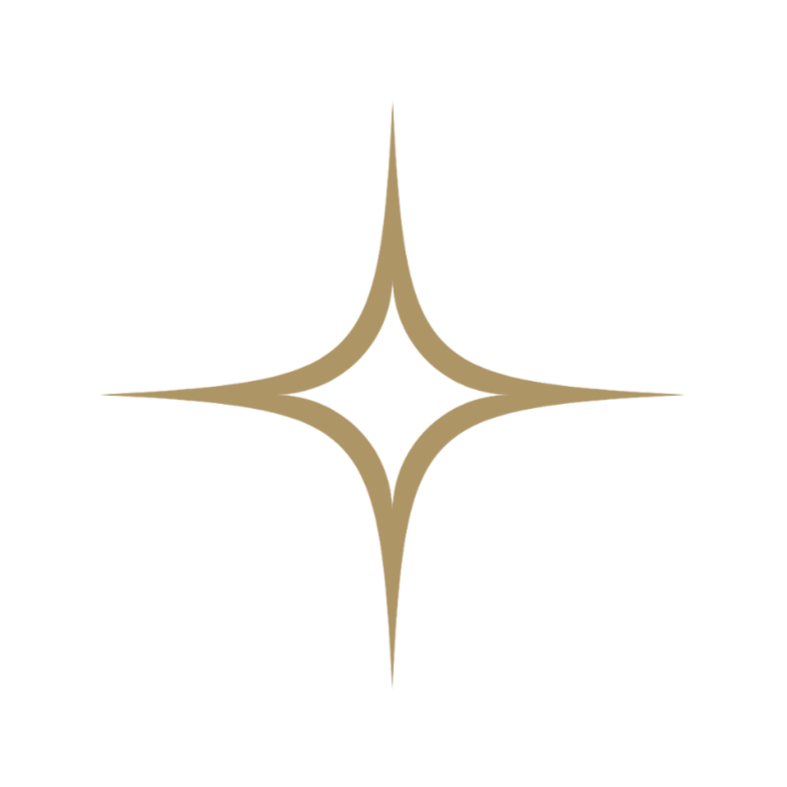 A stylized star-shaped logo in gold with four elongated points on a transparent background.