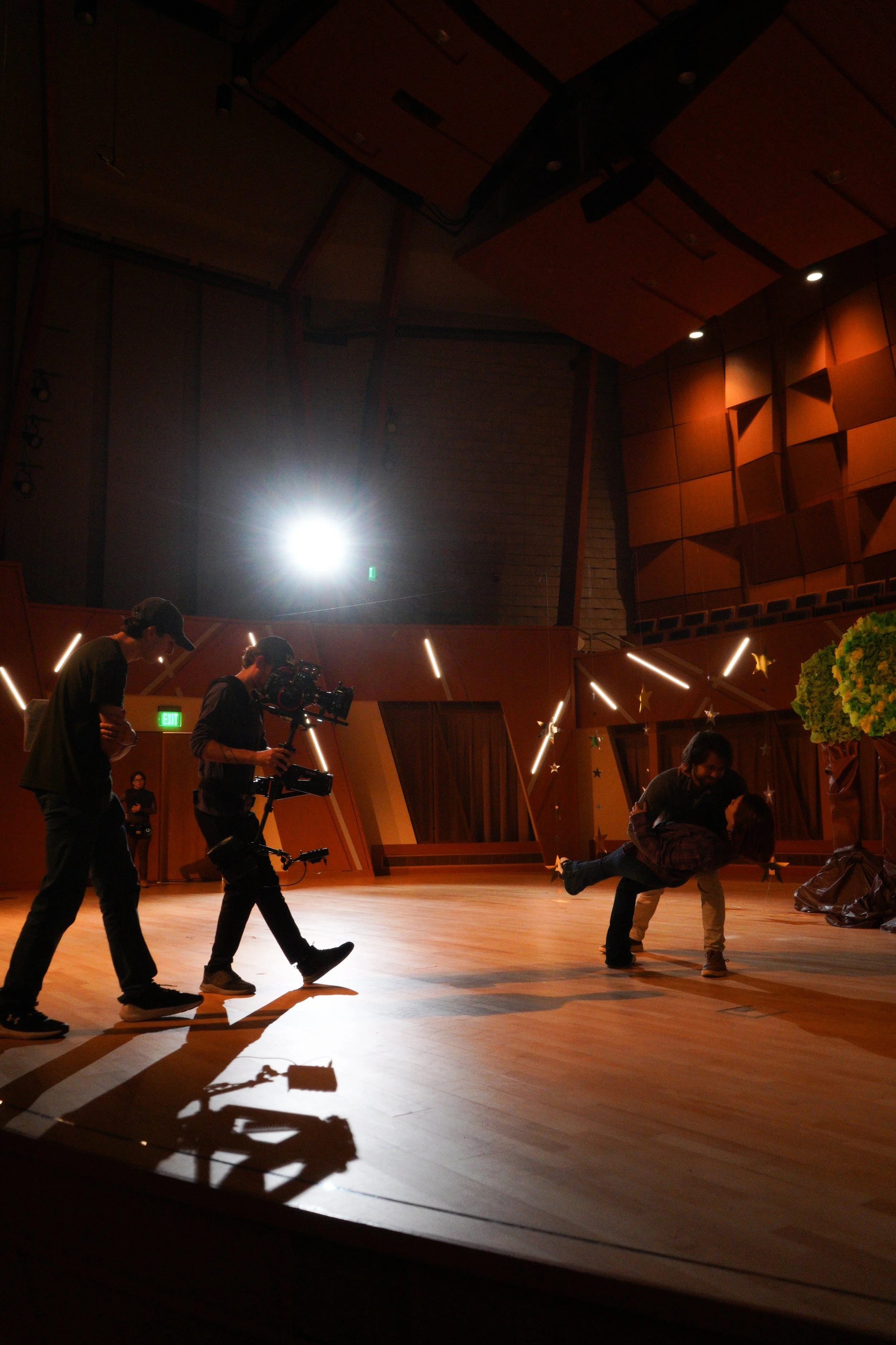 Aidan directs his cast and crew on the set of Sonder as they film a difficult dance sequence.