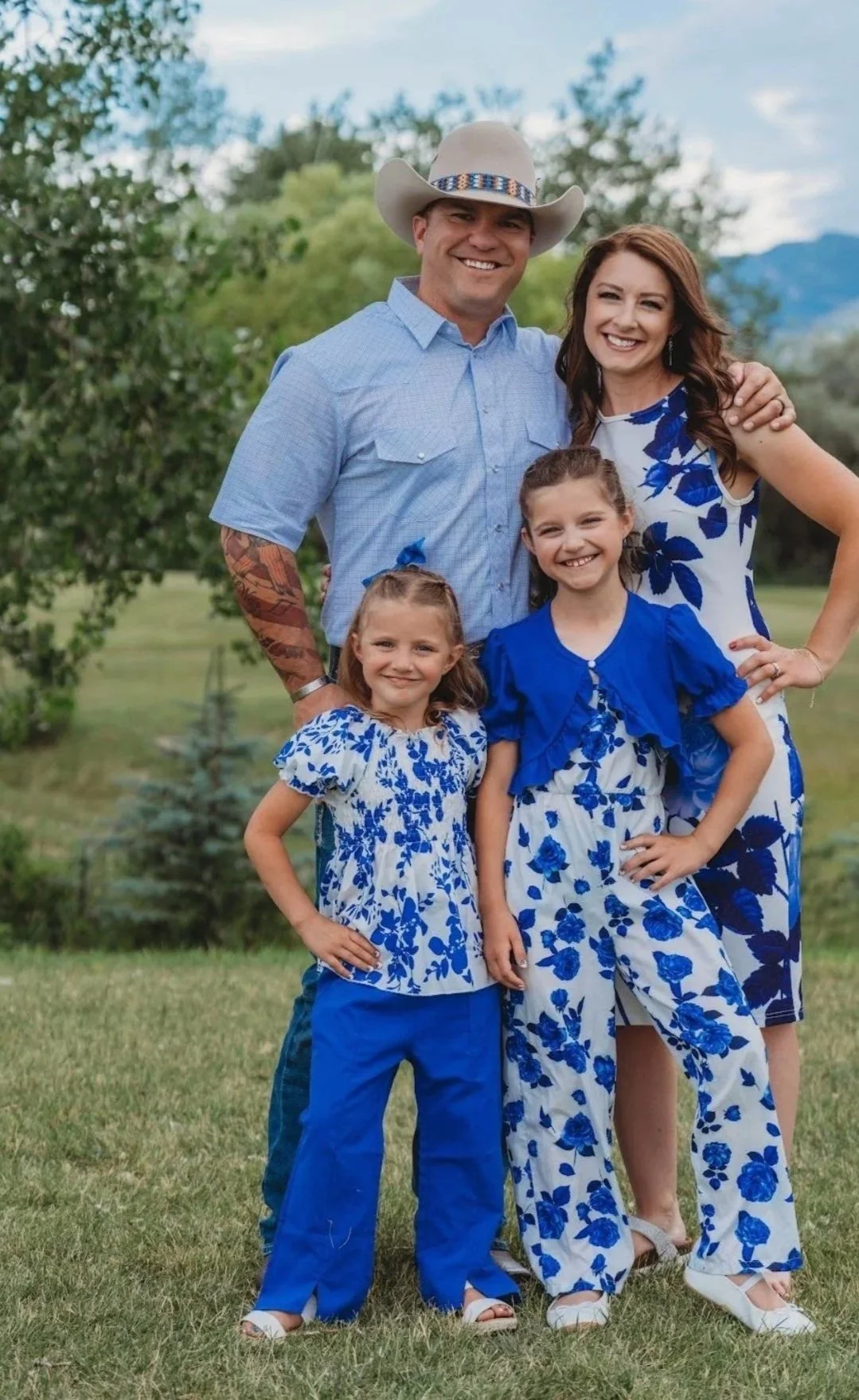 Cordell, Tiffany, Harper, and Hazel Betters pose for a family photo in a picturesque location.