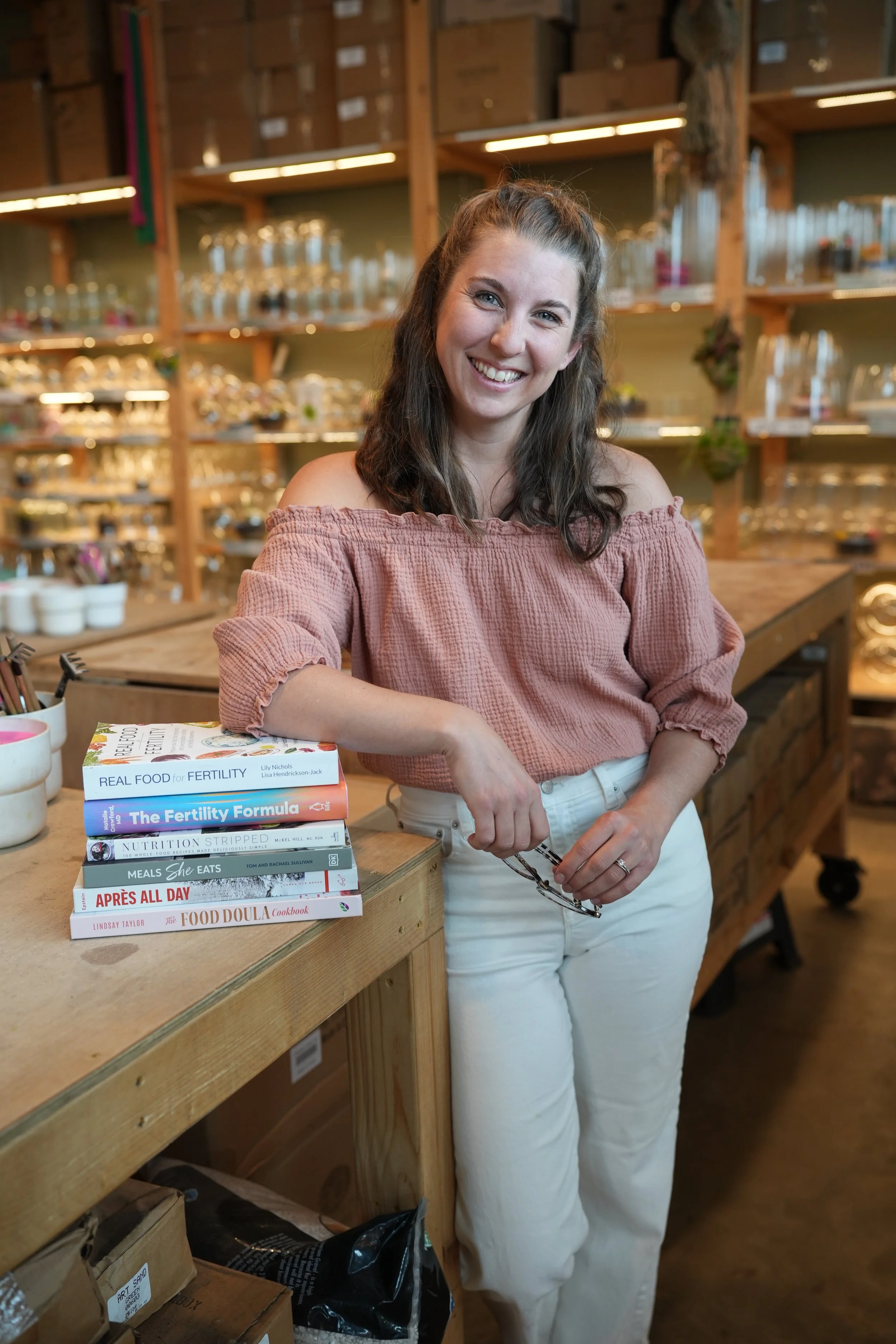 Fertility dietitian and ivf nutritionist Jordan Langhough with fertility nutrition books