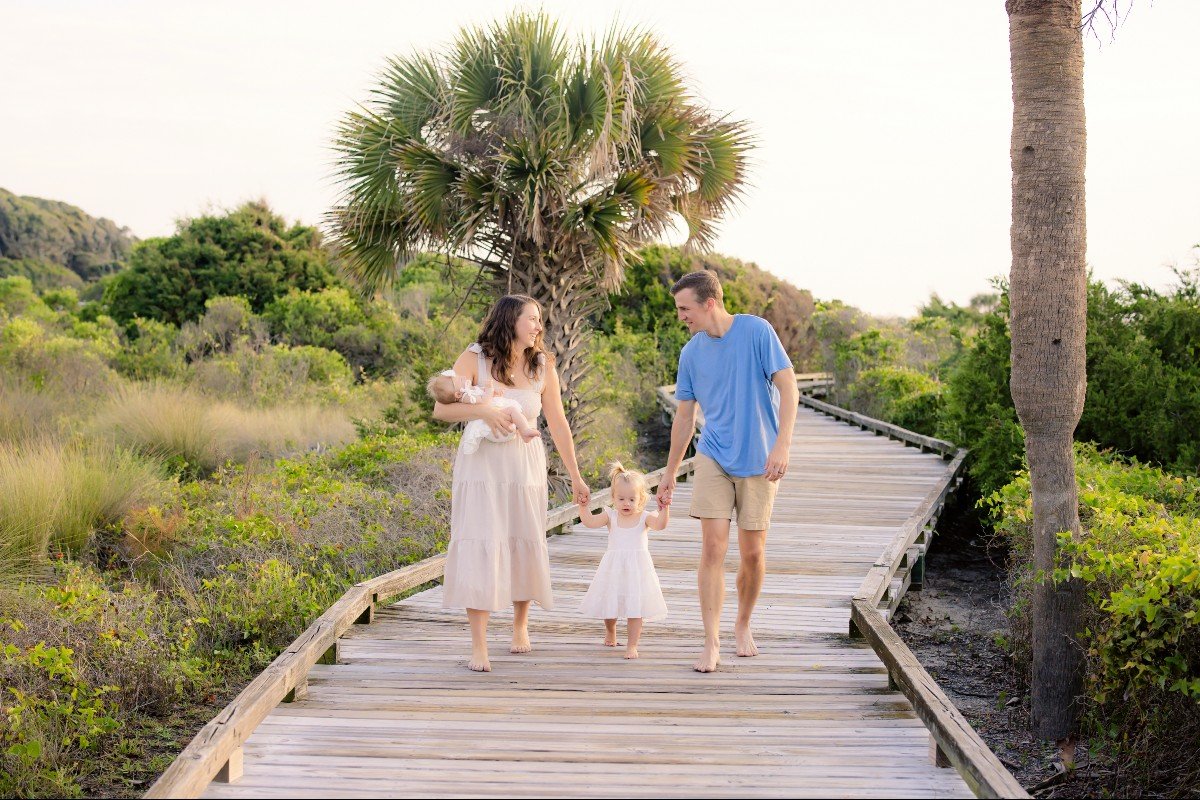 Jordan's family of four walking a tropical boardwalk — life after the fertility journey