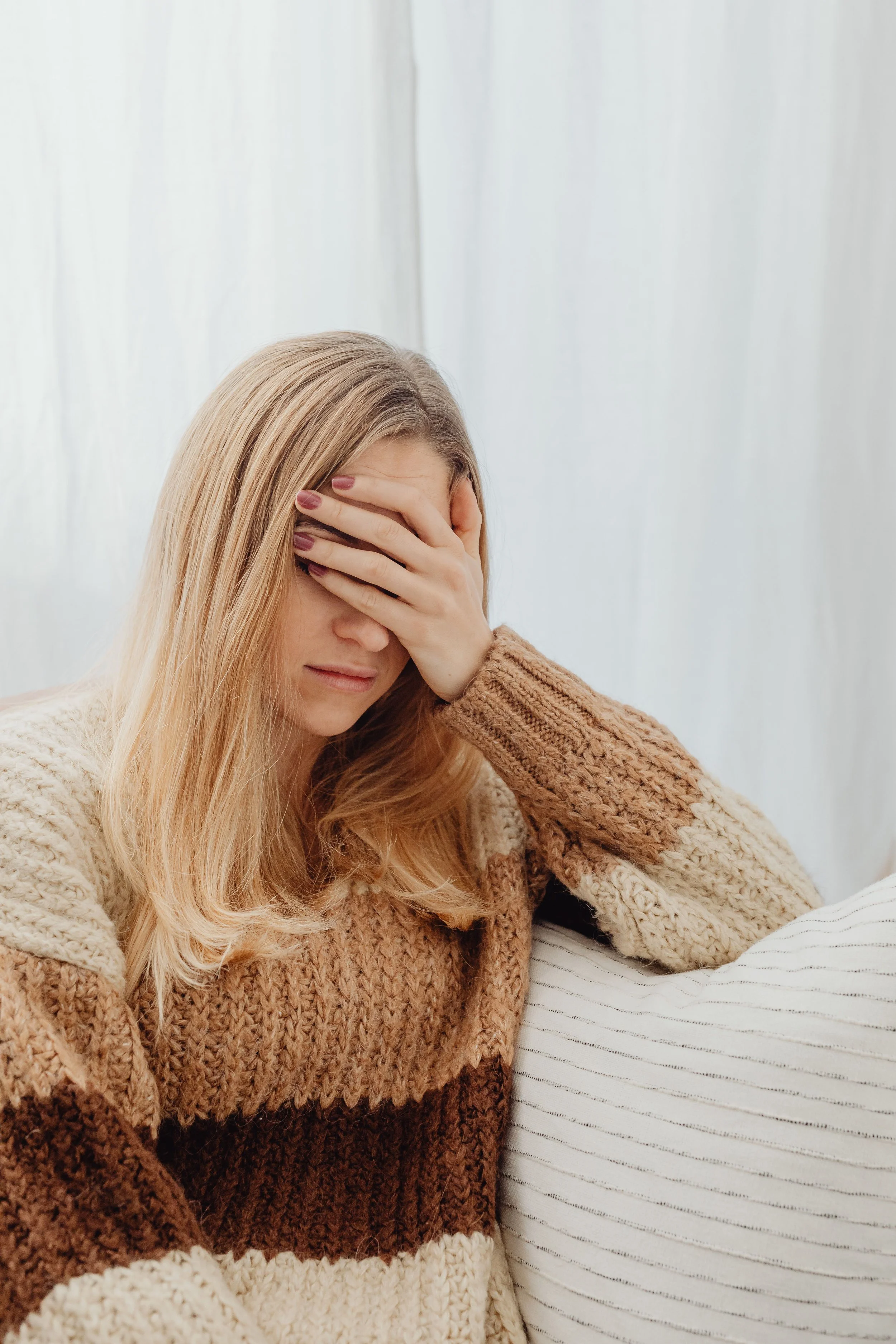Tired woman resting — support through fertility stress and pregnancy fatigue